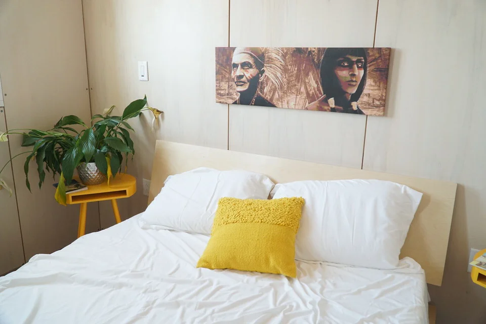 The picture over the bed depicts Isaac Harmon (at left) who was a Nanticoke Assistant Chief in the 1920’s. To &nbsp;the right is his great-grandson Kyle Harmon, who is on the reACT team.&nbsp;