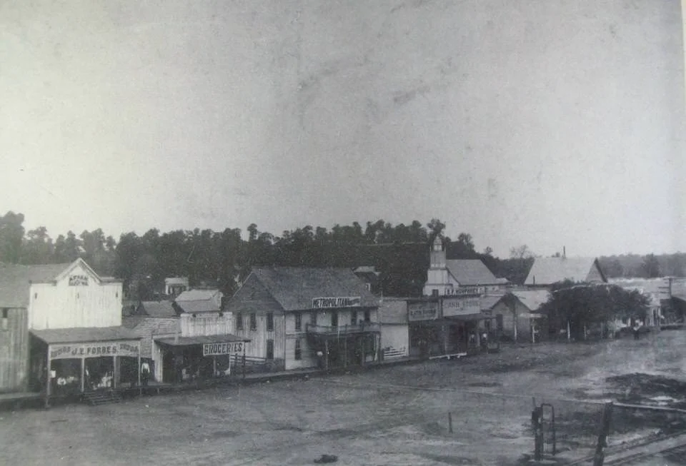 First know photo of "Poteau Switch" circa 1875. Notice rail-bed at bottom left. This original townsite area (aka. Old Town) was destroyed by fire in 1890. The downtown center moved to a new Main Street called Dewey Avenue. See the progression above.
