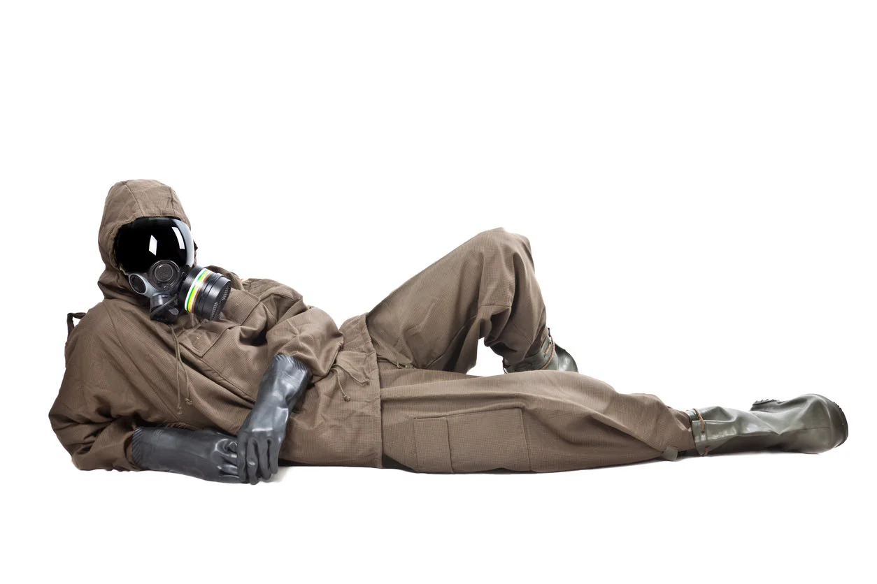 Person-Lying-Down-Hazmat-Suit-Toxic-Building-Materials.jpg