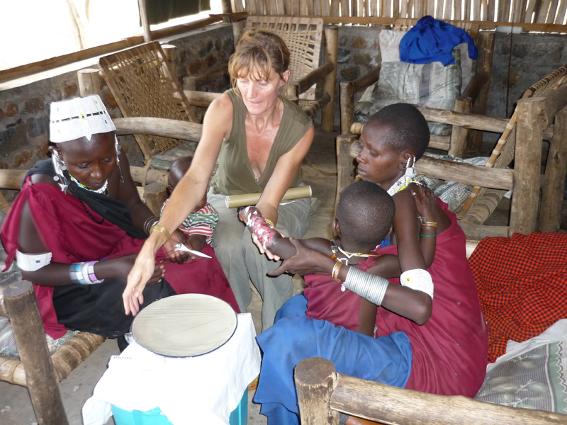 Mel helps to dress a burned child