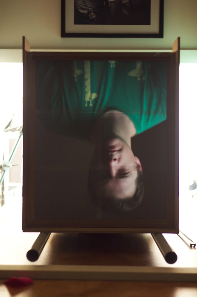 View from the back of the camera – Piotr’s image appears upside-down on the tracing paper ground glass on the back of our 20×24 camera – it works!