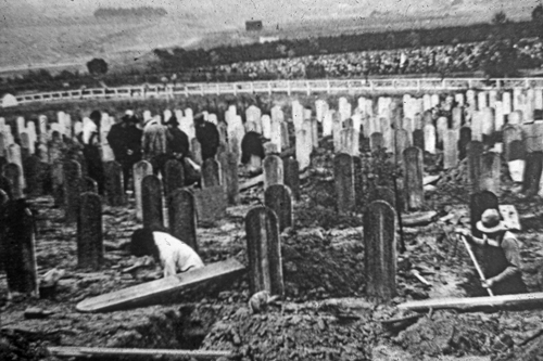 Chinese bonepickers moving through the Chinese cemetery in Colma, outside San Francisco. This process came to almost every Chinese cemetery in California. 