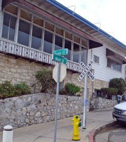 The stone wall at the corner of Beach and Main is all that remains from the era of the Sea Beach Hotel.