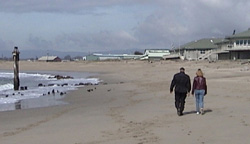 Moss Landing today, looking north. The Monterey Bay Aquarium Research Institute building are on the left, and the boulders that marked the ocean end of the whale station slipway are in the distance on the left.
