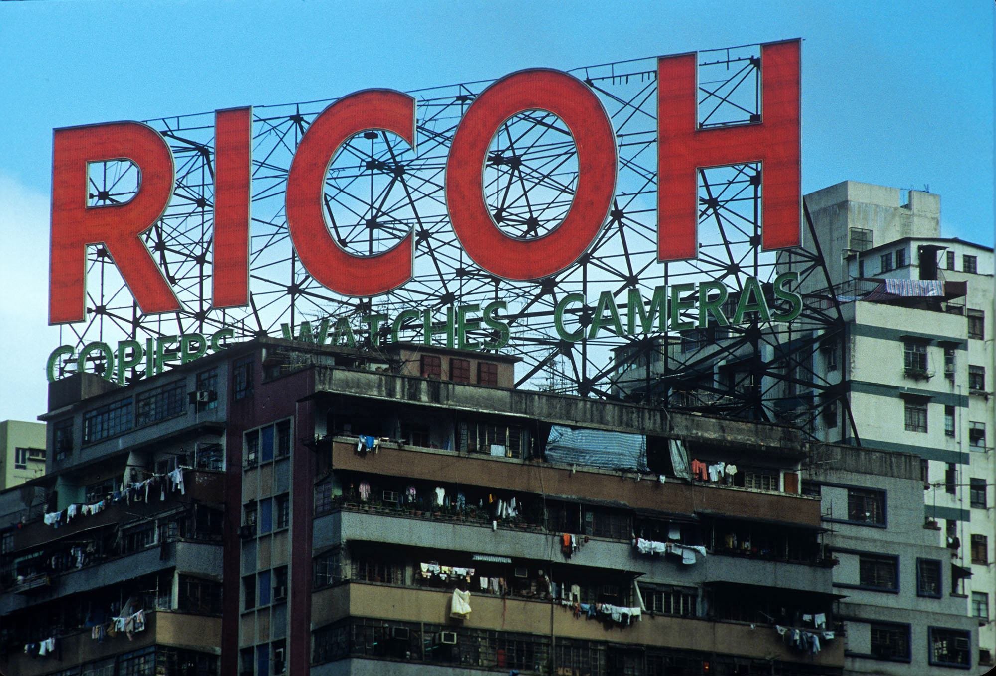 Greg Girard, Ricoh sign, Causeway Bay, Hong Kong 1986, Courtesy of Blue Lotus Gallery