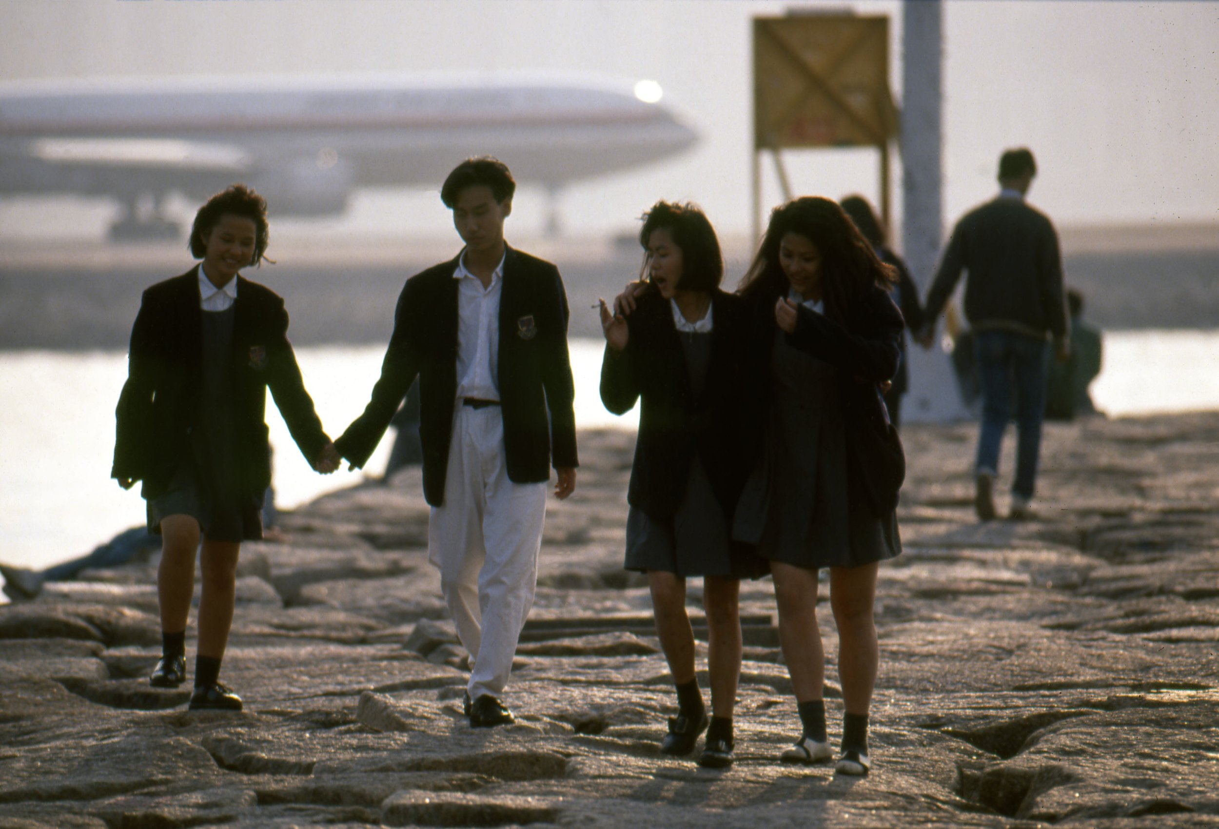 Greg Girard, Students after school, Kwun Tong breakwater, Hong Kong 1987, Courtesy of Blue Lotus Gallery