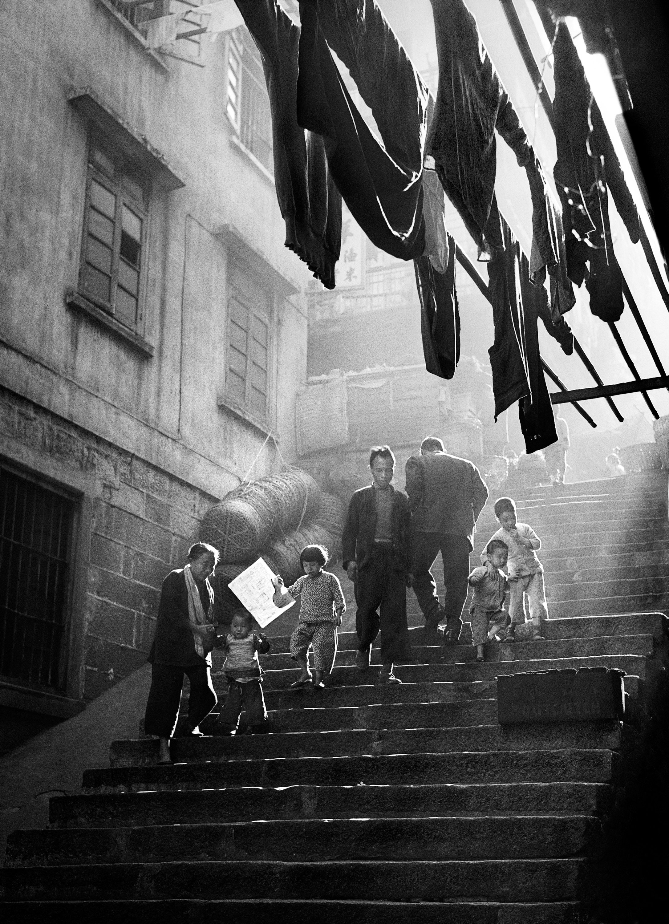 © Fan Ho_Street scene, Hong Kong 1957.jpg