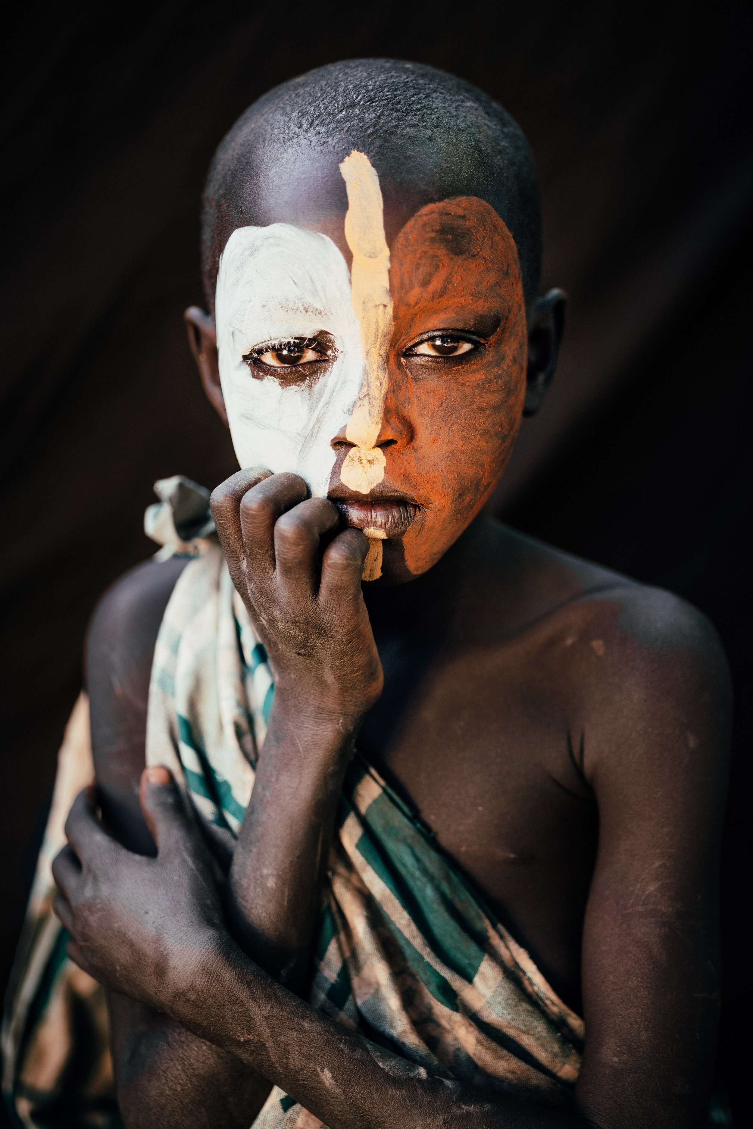 Andrew Eldon_Suri Woman with Tartan Robe_Omo Valey, Ethiopia 2023_Courtesy of Blue Lotus Gallery