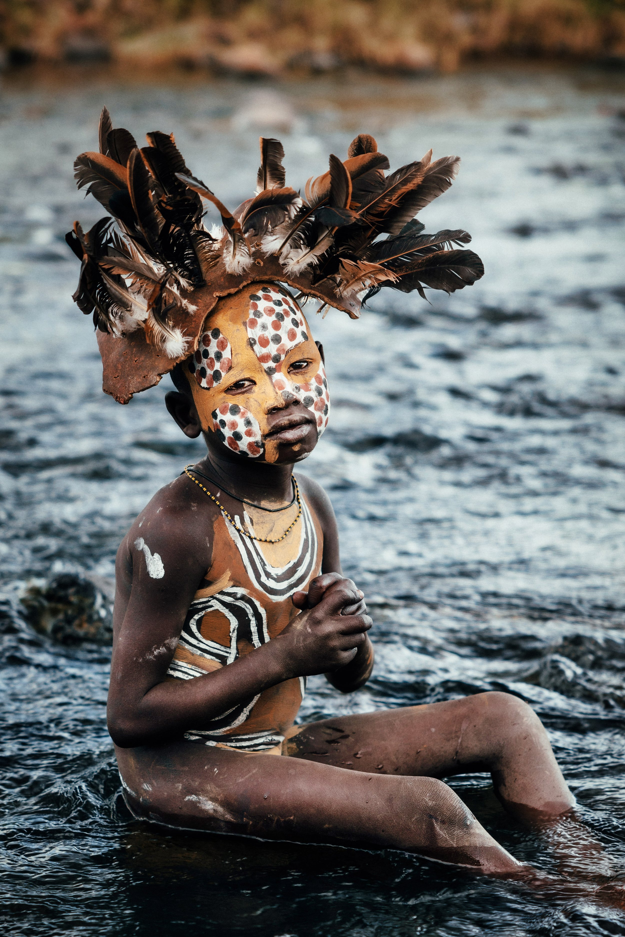 Andrew Eldon_Suri Boy in River_Omo Valey, Ethiopia 2023_Courtesy of Blue Lotus Gallery
