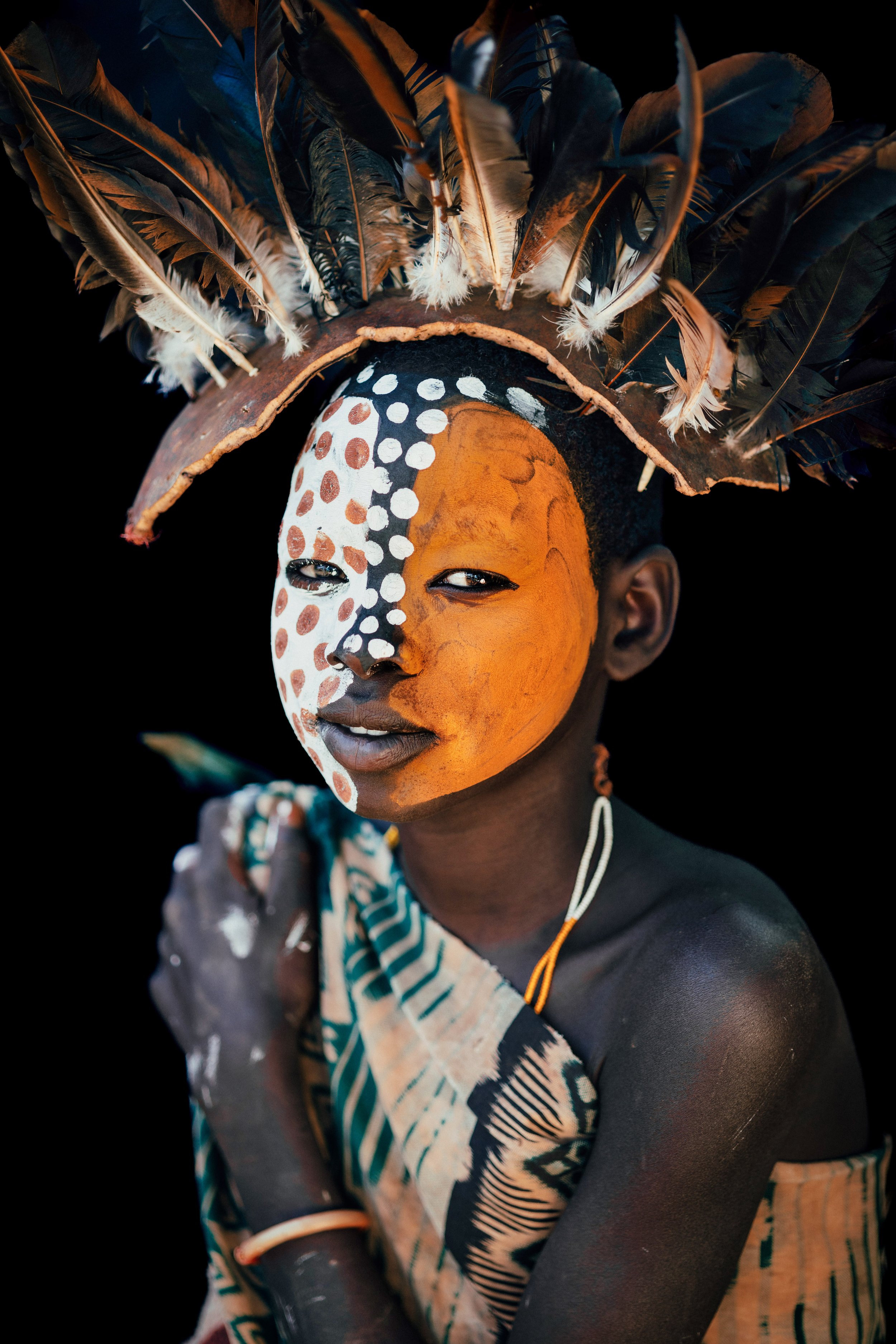 Andrew Eldon_Suri Girl in Feather Headress_Omo Valey, Ethiopia 2023_Courtesy of Blue Lotus Gallery