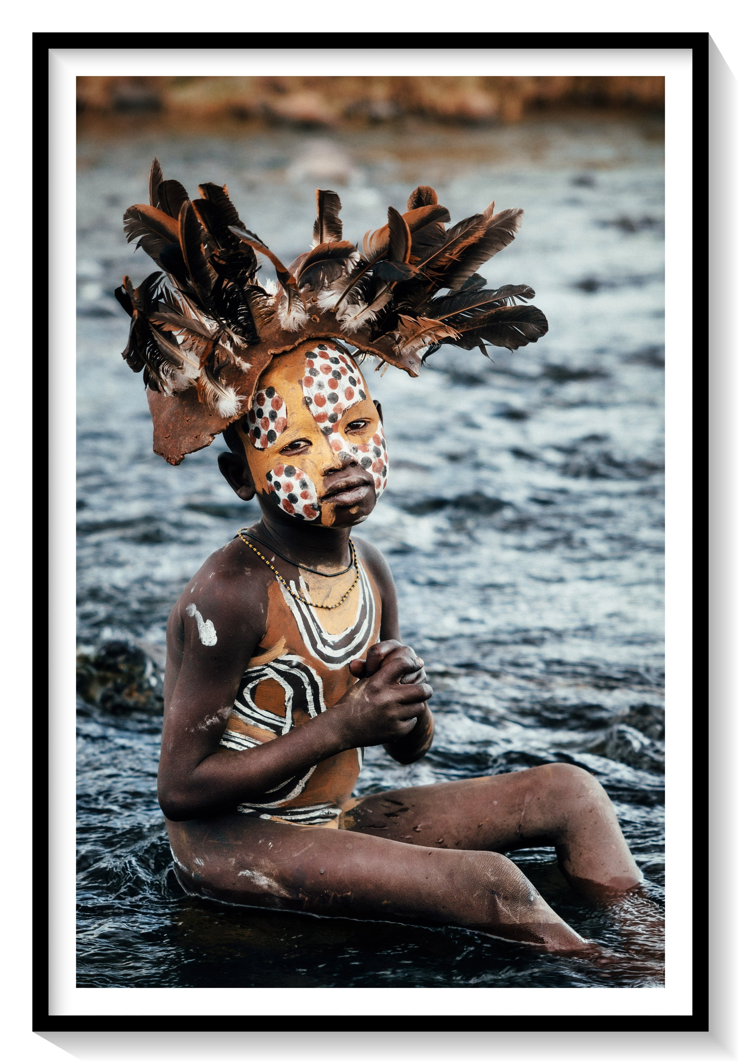 Andrew Eldon_Suri Boy in River_Omo Valey, Ethiopia 2023_Courtesy of Blue Lotus Gallery_framed.jpg