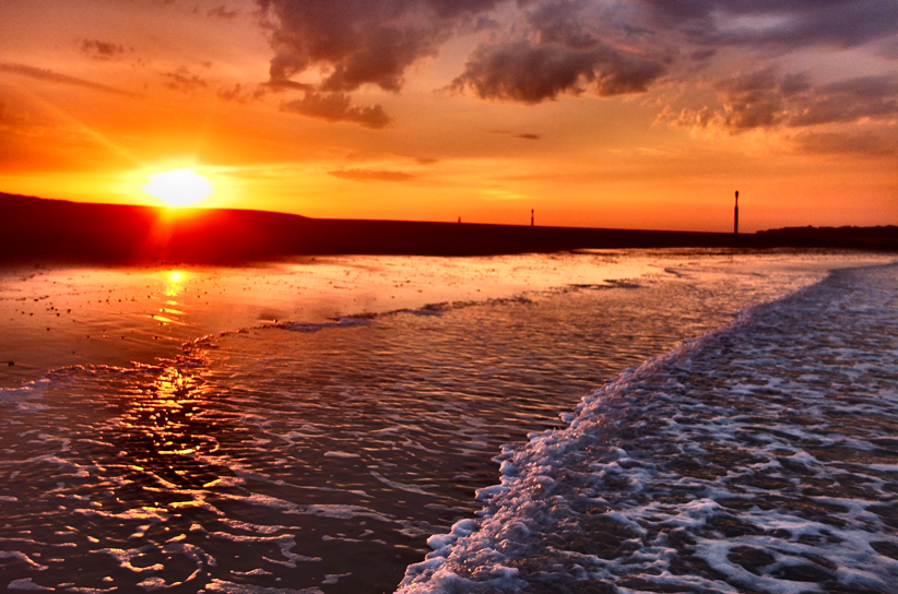 Sunsets over the land and sea