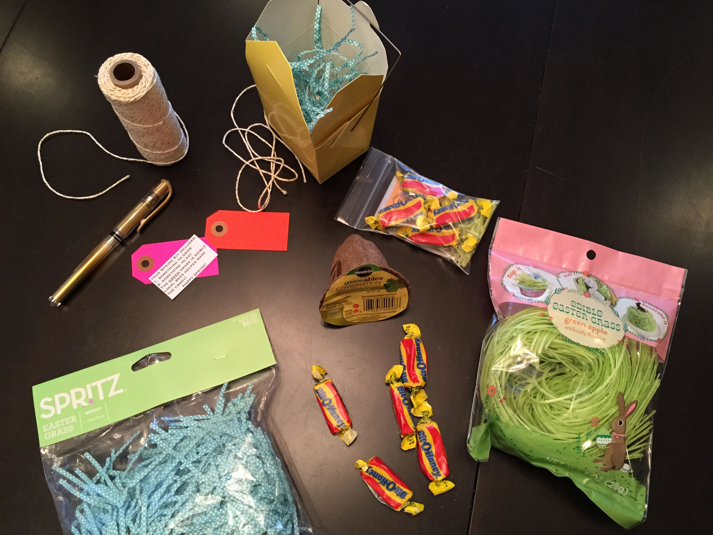 EDIBLE GRASS (FLAVORED GREEN APPLE) AND BLUE PAPER EASTER BASKET GRASS SOLD AT TARGET. I ONLY USED ONE PACKAGE OF EACH FOR 20+ KITS. BIT O HONEY BOUGHT AT LOCAL HONEY STORE AND GIVEN IN PLASTIC BAGS FROM YELLOWPINWHEELS.COM TO KEEP CANDY FROM TASTIN…