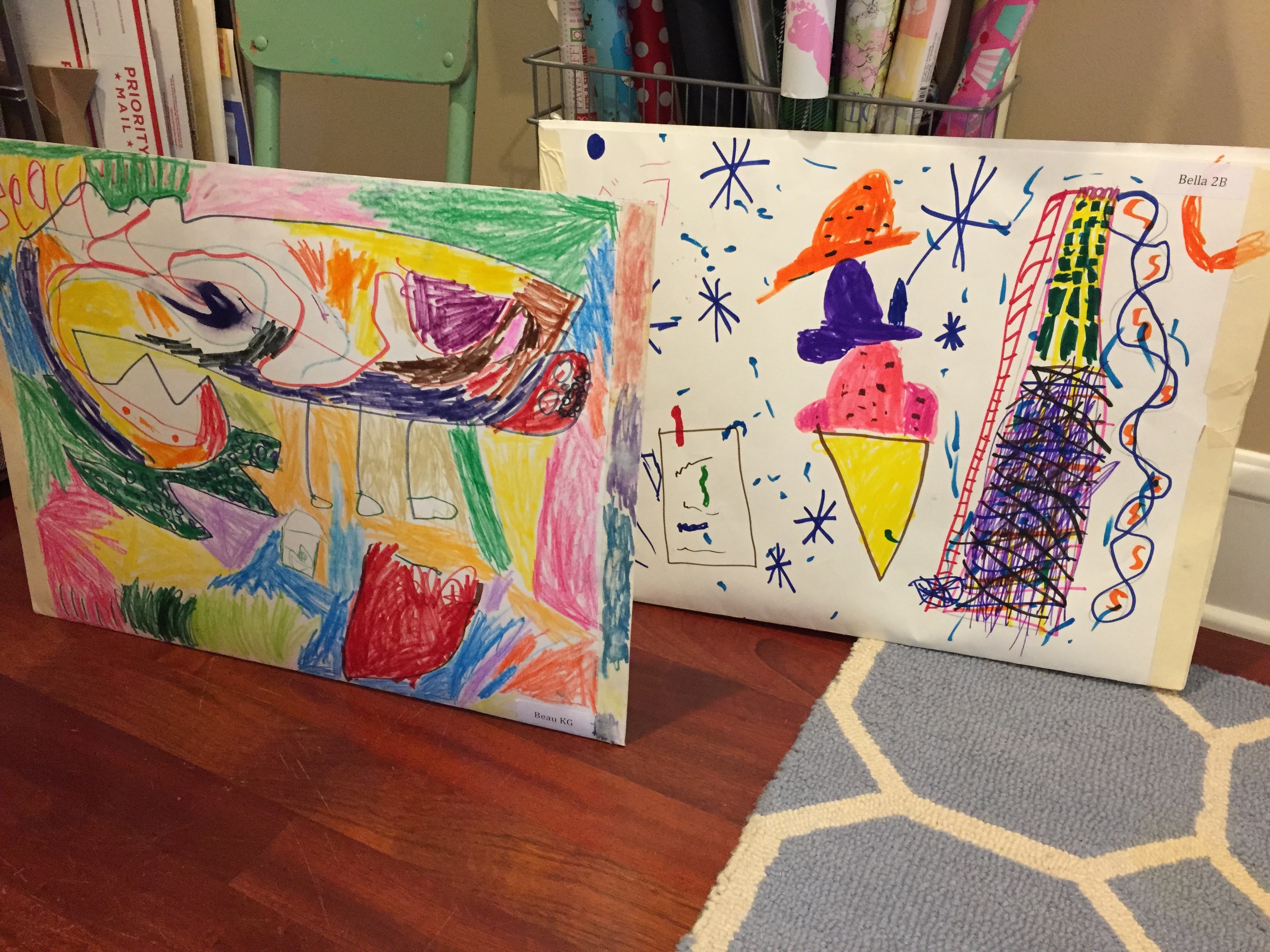 These two pockets came home with my kids at the end of the school year (June 2015). The teachers took two poster boards and taped them together to create a big portfolio to hold artwork throughout the year. I will use these same pockets to collect artwork this whole school year 2015-2016. When it's time to send the grandparents their art books in September 2016, I will take apart these two pockets, which equals 4 poster boards in total and use 3 out of the 4 poster boards. Fold each in half and use them as envelopes for the art books. One poster board remains for next year. Recycling at it's finest.