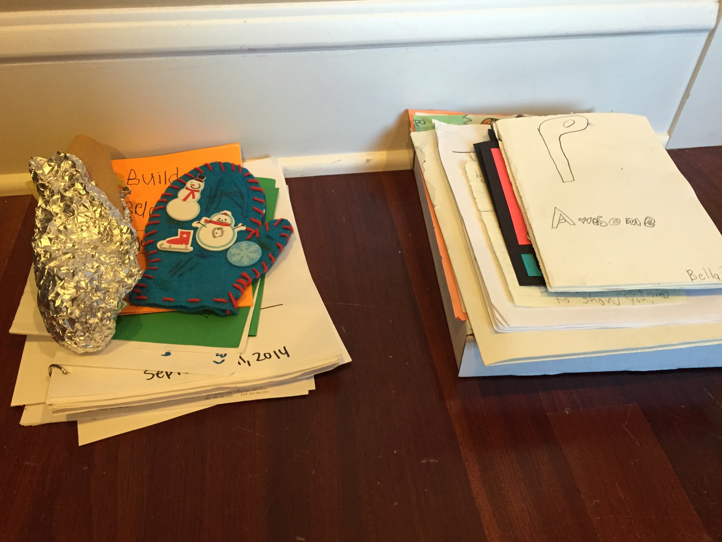 These two piles of artwork are what I'm keeping for each child. Too precious to give away. Meanwhile... there are two full grocery bags filled with stuff that will be recycled.