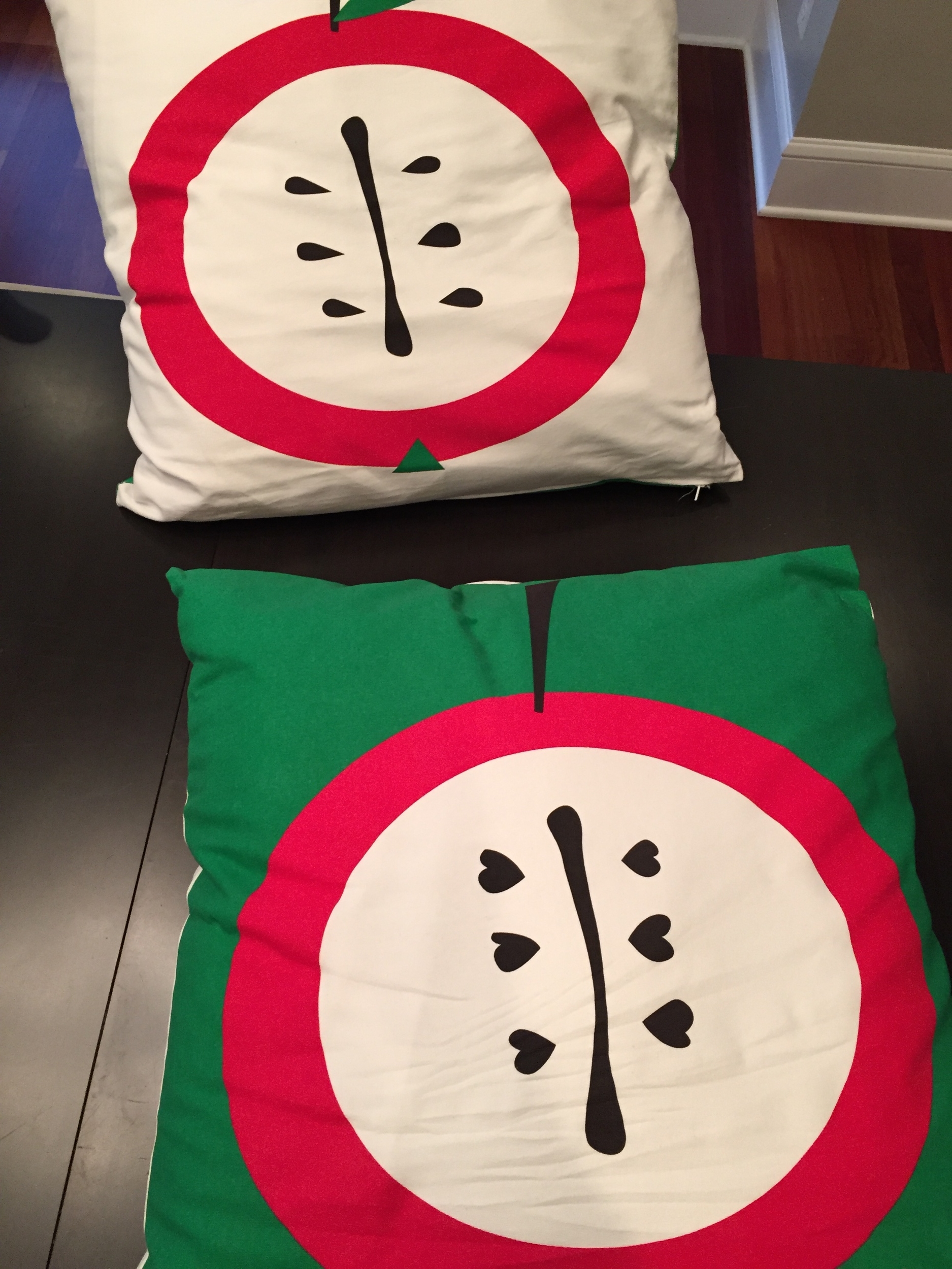 Last year I found these large apple printed pillowcases at Ikea for $5 each. I coated the pillows with Scotch Guard and now they are on the front porch chairs.