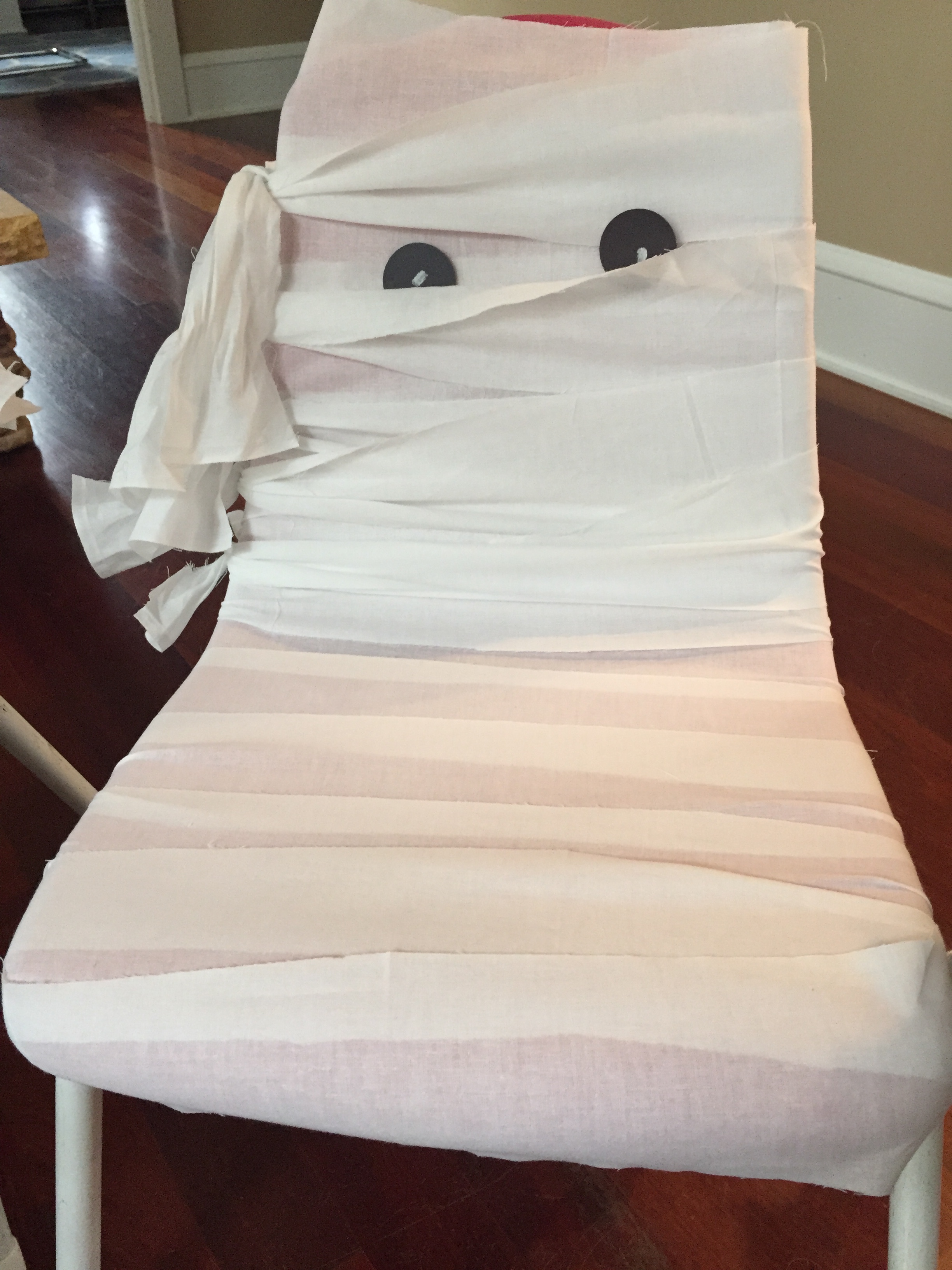 Rented 12 chairs for a total of $22.35. Wrapped them up like mummies. Material was $1.99 a yard and I bought 24 yards but only used 20 yards. I used a 60% coupon at JoAnn's Fabric. Total cost per chair = $3.19.