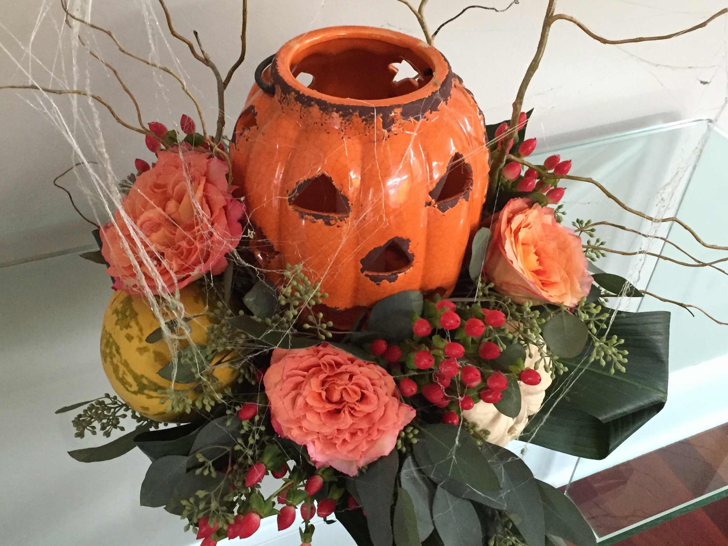 This floral arrangement is great - the pumpkin is ceramic so you can light a real candle inside. They used real whole squash in the bouquets. $50 for identical arrangements from Arts &amp; Flowers. Two arrangements = $107.28