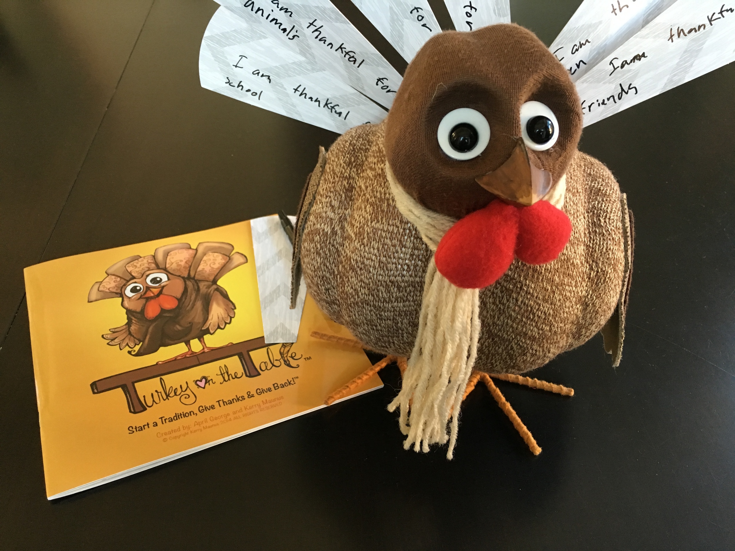 Included in the Turkey on the Table kit: a children's book, a pen, "feathers" which are made out of paper and this turkey. Aww, cute! My daughter wrote on almost all of the feathers leaving us with only a handful. Luckily, I bought another pack of feathers!