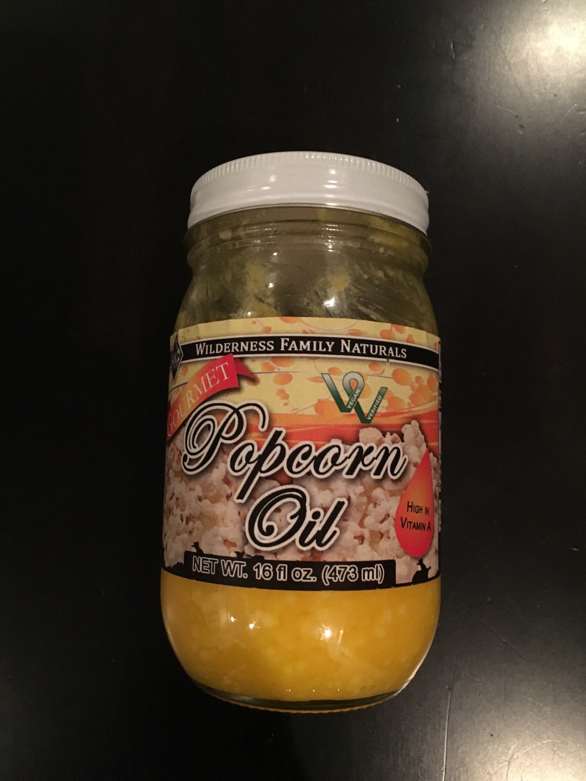 My friend Sharis introduced me to her popcorn recipe during her Souper (Super) Bowl party three years ago. The kids and the adults could not get enough of it! I wanted to pass along her little pinch to you today because it’s so delicious. This snack is full of nutrition and flavor. If you have a popper just place 3/4 cup of kernels with 2 tablespoons of coconut oil and pop as usual. After the sound of popping starts to slow down, pour a desired amount of Wilderness Family Naturals popcorn oil on top. Salt generously, sprinkle with plenty of nutritional yeast and serve in a big bowl. For the stove top method put in 3 kernels of corn to test the heat of the coconut oil in a large pan with a lid. When those 3 kernels pop, add the 3/4 cup of corn and continue as the directed above with the WFN, salt and nutritional yeast.