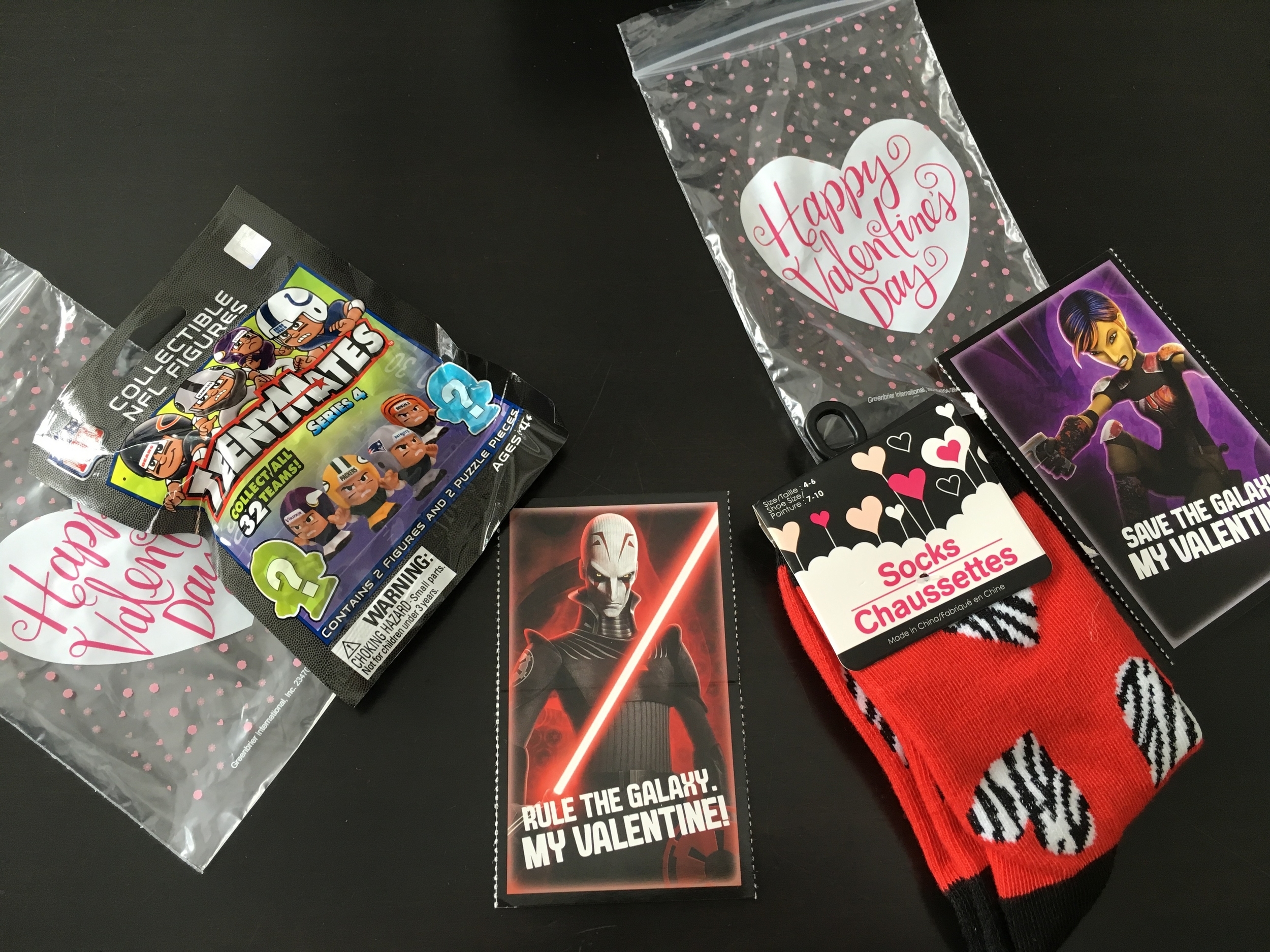 For my sons classmates - Teeny Mates (Target) for $3.99 a pack - two figures come in a pack and socks $1 each from The Dollar Tree. We put each item in a treat bag with a Star Wars Rebel valentine. The treat bags and cards are from The Dollar Tree.