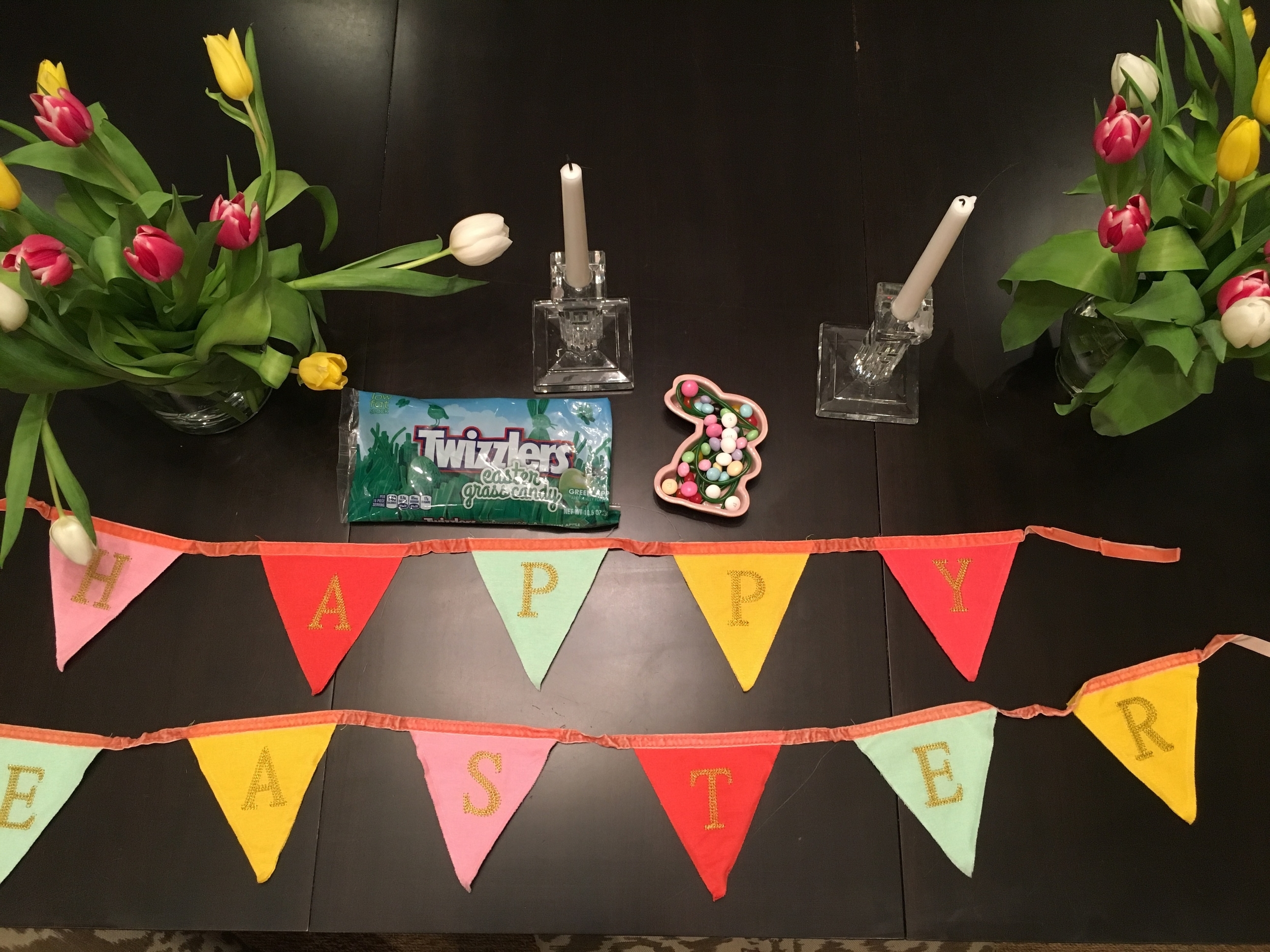 Minimal decor: a banner (Target 2015) and some candy in dishes (circa Target 2007 - $1 each) I have 8 dishes scattered around. M&M’s Strawberry Shortcake and M&M’s Crisp, Starburst Jellybeans and Twizzlers Easter Grass licorice.