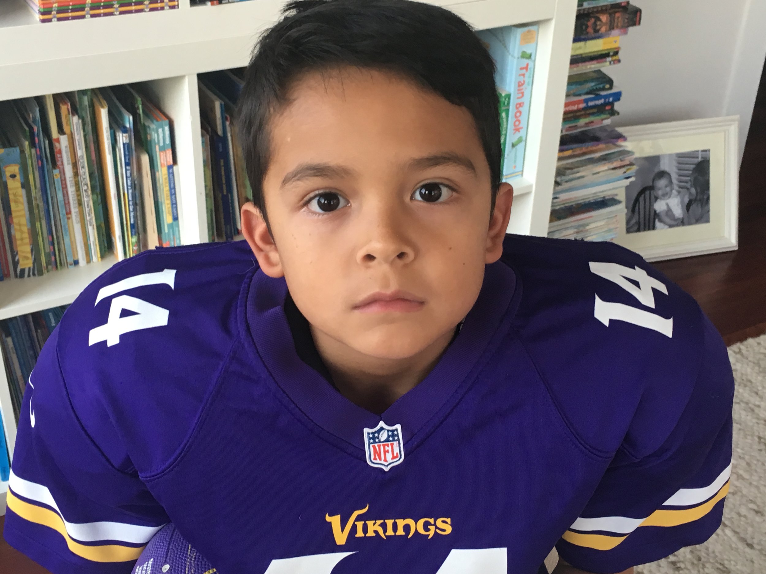 We used this photo for the invitations to his giant-play-date-style birthday party. He's got his football face on.