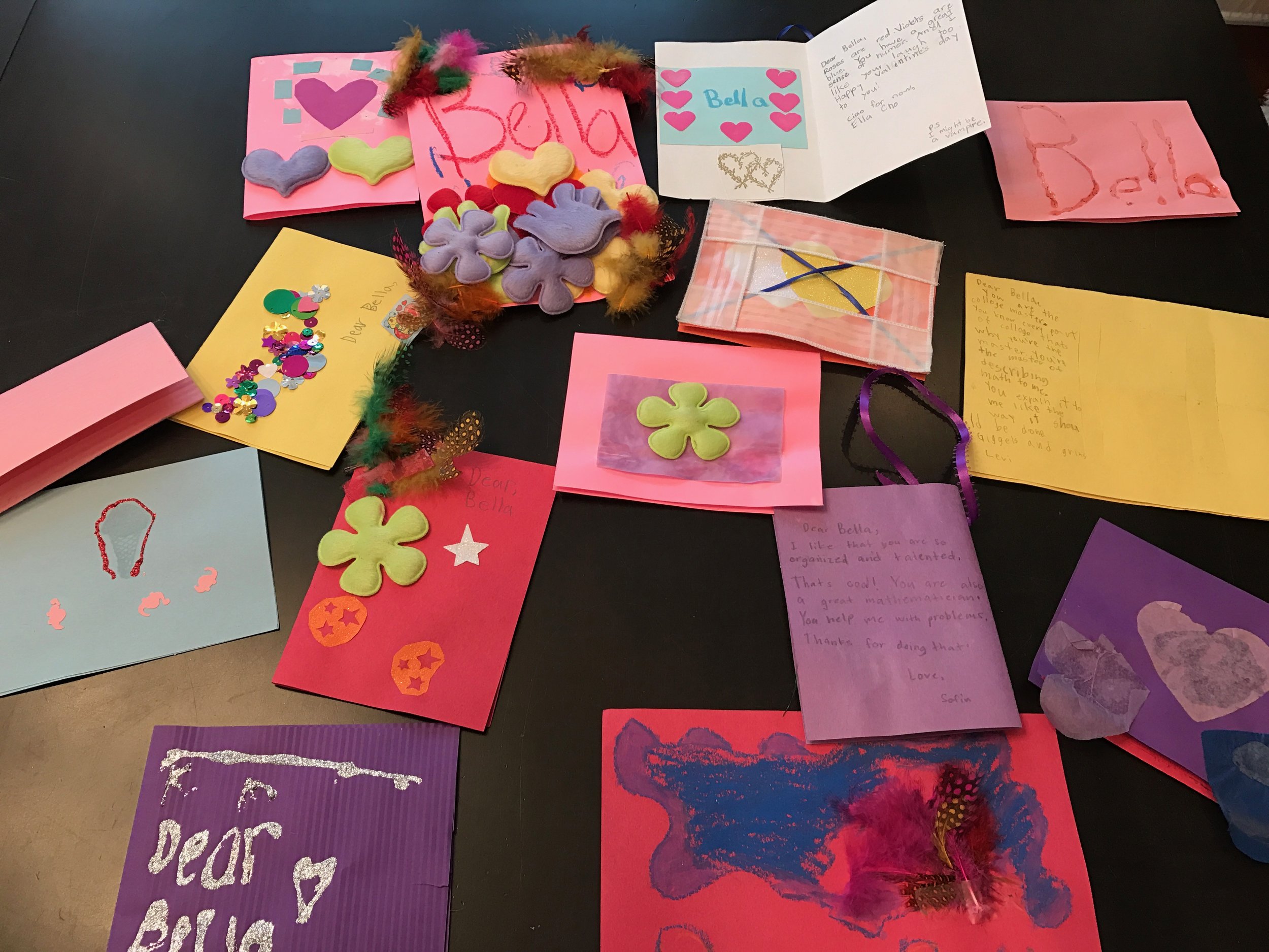 One card says: "You are a very nice talented person! You are always cute! You are a very very focused thinker! Happy (picture of a heart) day! Another card says: Dear Bella you are a very good mathematician because when you write numbers down they d…