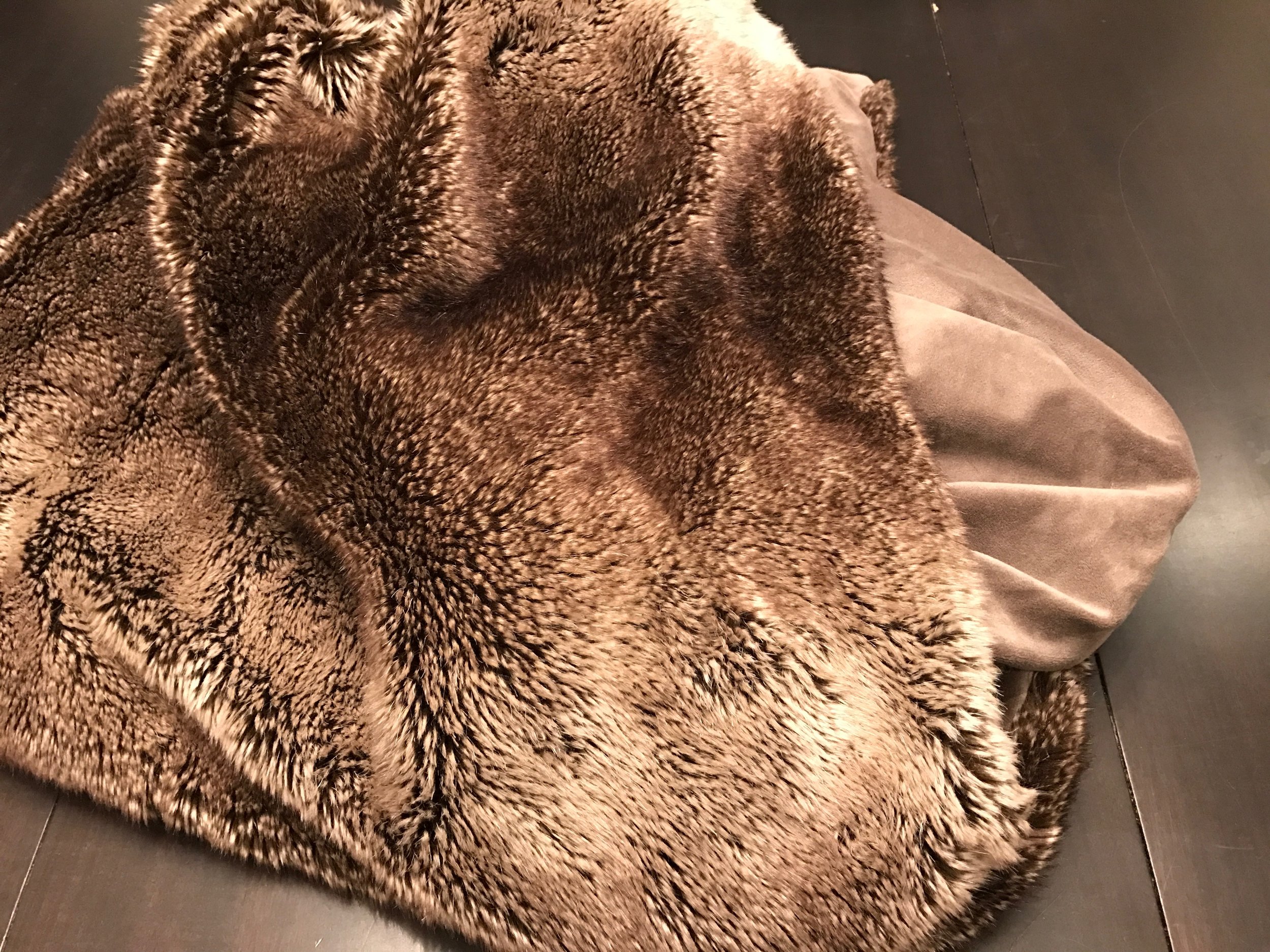We have two of the blankets in this dark color, a white one for my son and a light brown one for my daughter. The kids' blankets are not photographed because both kids are asleep with them right now. Restoration Hardware . 