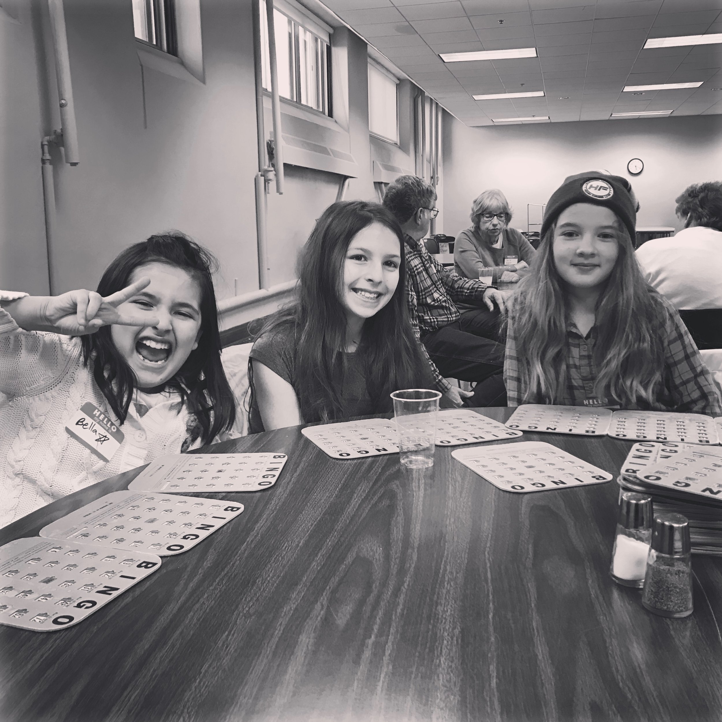 Instagram Message: The church bingo prizes were mostly an assortment of "re-gifts". These girls didn't care, they were in it to win it!