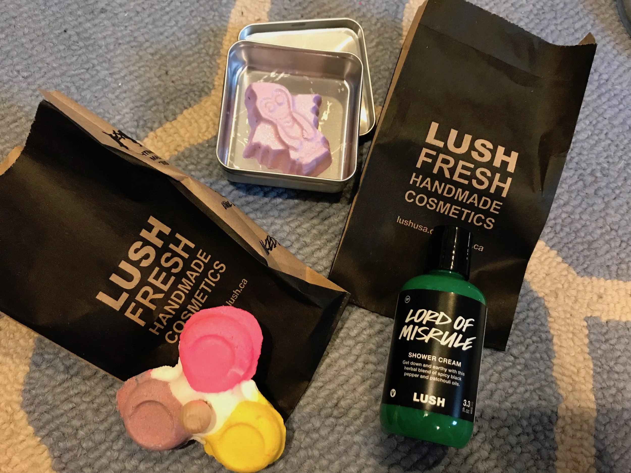 I hope to put Goth Fairy lotion on my daughter when I give her a shoulder rub or a leg rub. My son is a total "gifts" Love Language guy. The green color of the Lord of Misrule shower gel is gross enough for any kid to get excited about. The spinners are fun too. In order to use, get into the bathtub and hold the wooden pegs in the center of the spinner under the faucet. The water will spin the spinner and it will fill the tub about five times with bubbles until its all used up. 