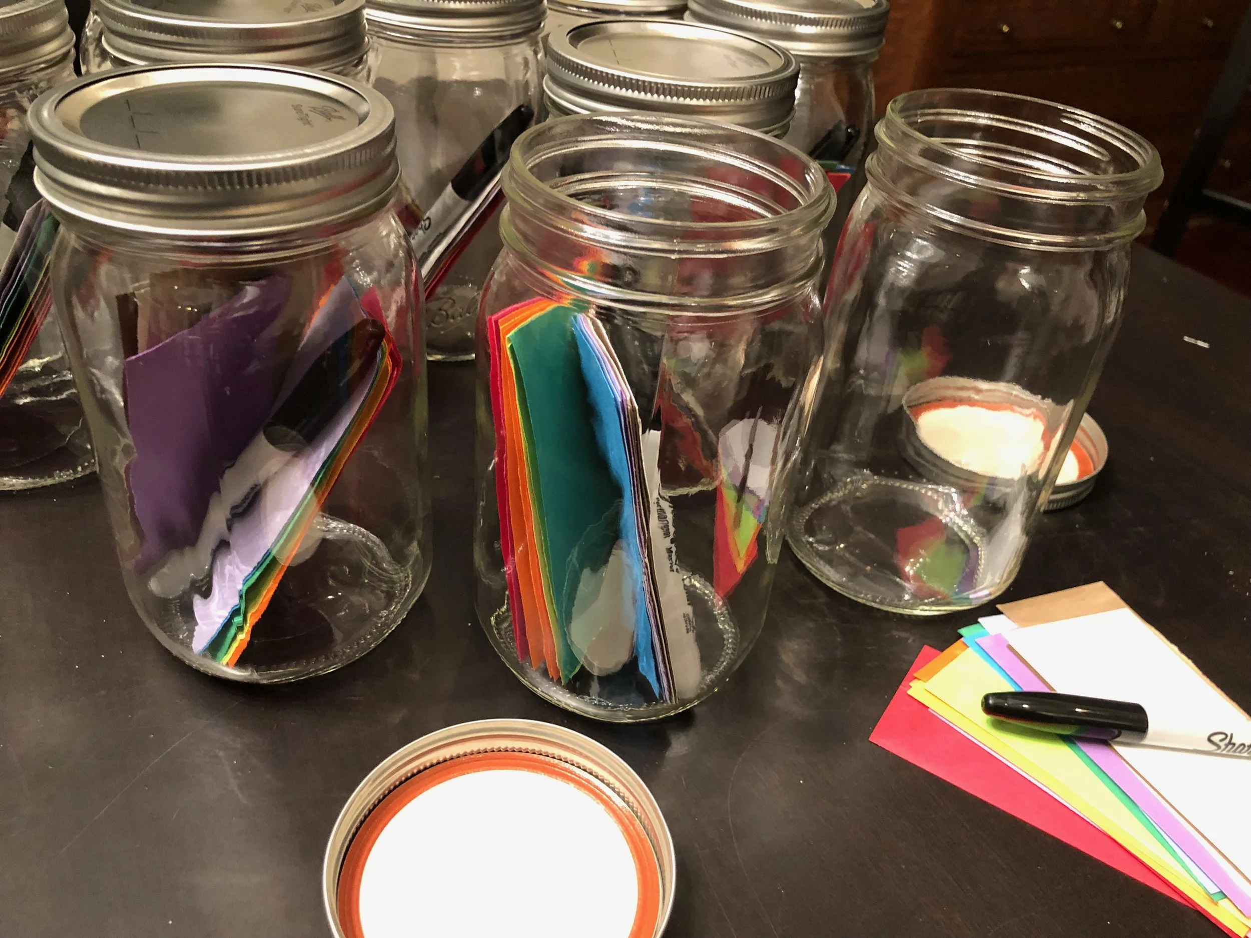 Each Gratitude Jar contains pieces of paper and a Sharpie. 