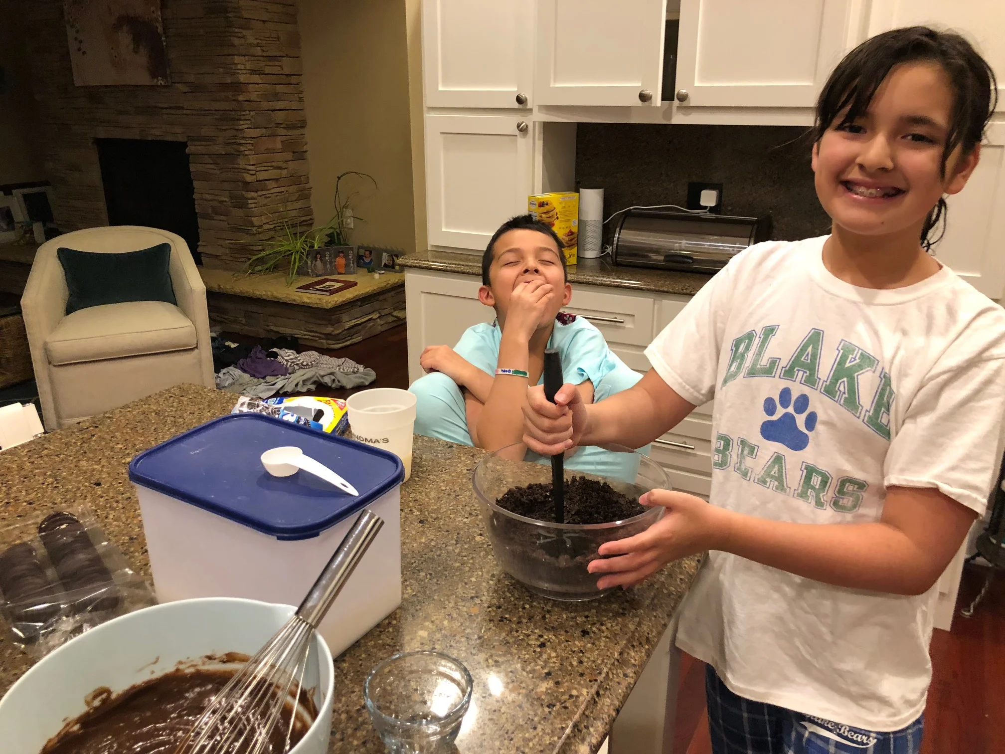 She made the pudding then soon took over making the dirt because he was too busy eating the Oreos that fell out of the bowl. 