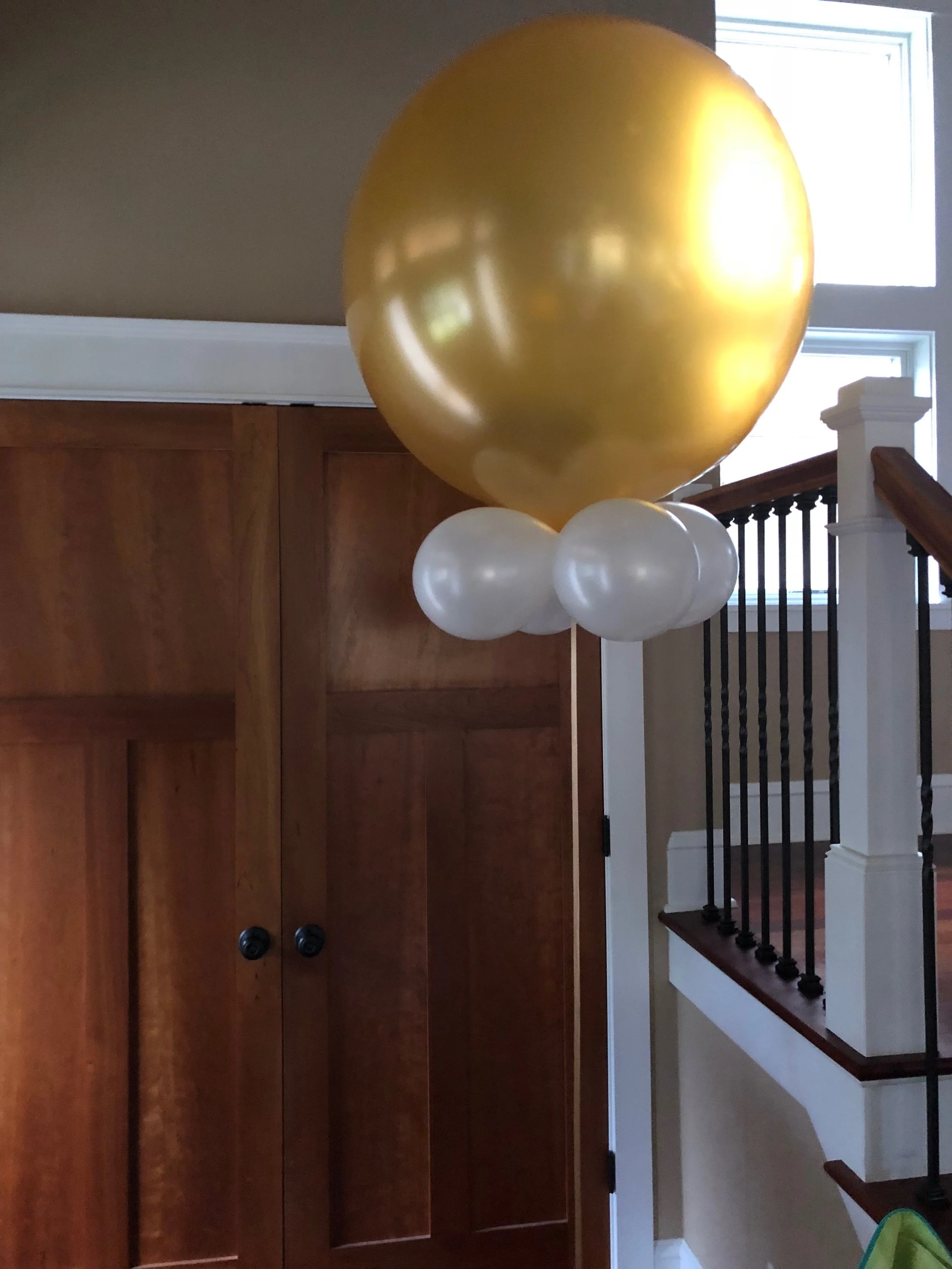 A gold balloon bouquet from my friend Allison. Last year she gave me a bouquet similar to this but with a big white balloon instead of gold. That big balloon lasted from the end of August to the end of October and we used it for a Halloween decoration because it looked like a floating ghost. Allison is a celebratory pincher* because she's always bringing over fun stuff for any occasion.