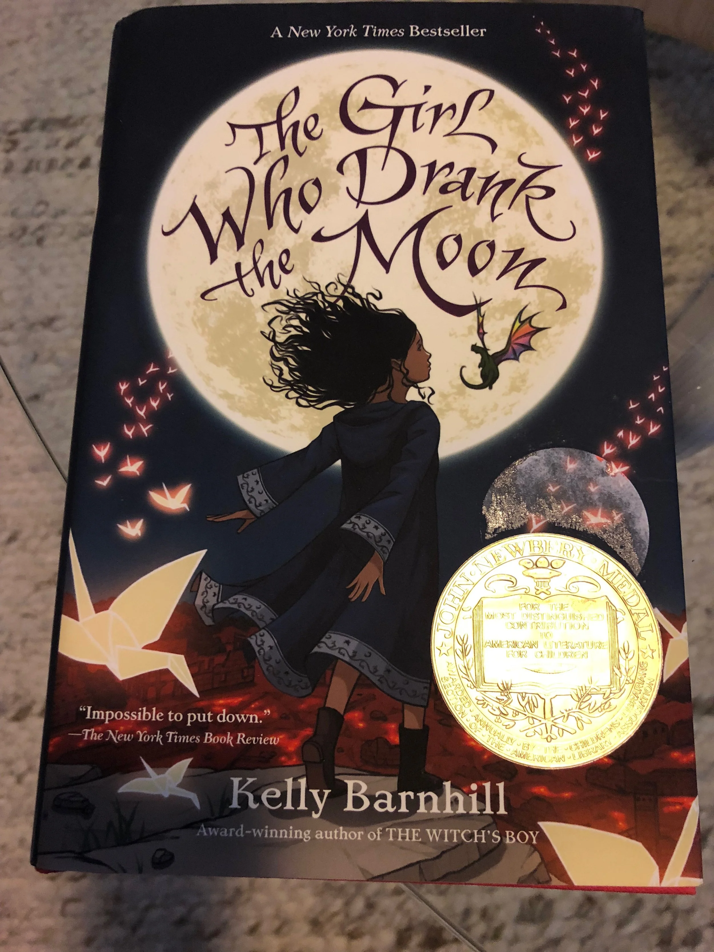 This book is a treat because the parents of the author of this award-winning book, are parishioners at the same church we attend. My daughter and I will be meeting Kelly Barnhill at a gathering that she donated to raise money for our annual church fundraiser. It’s awesome because we have other books that she wrote, but not this one! That’s because Auntie Jay-Jay just knows this stuff.