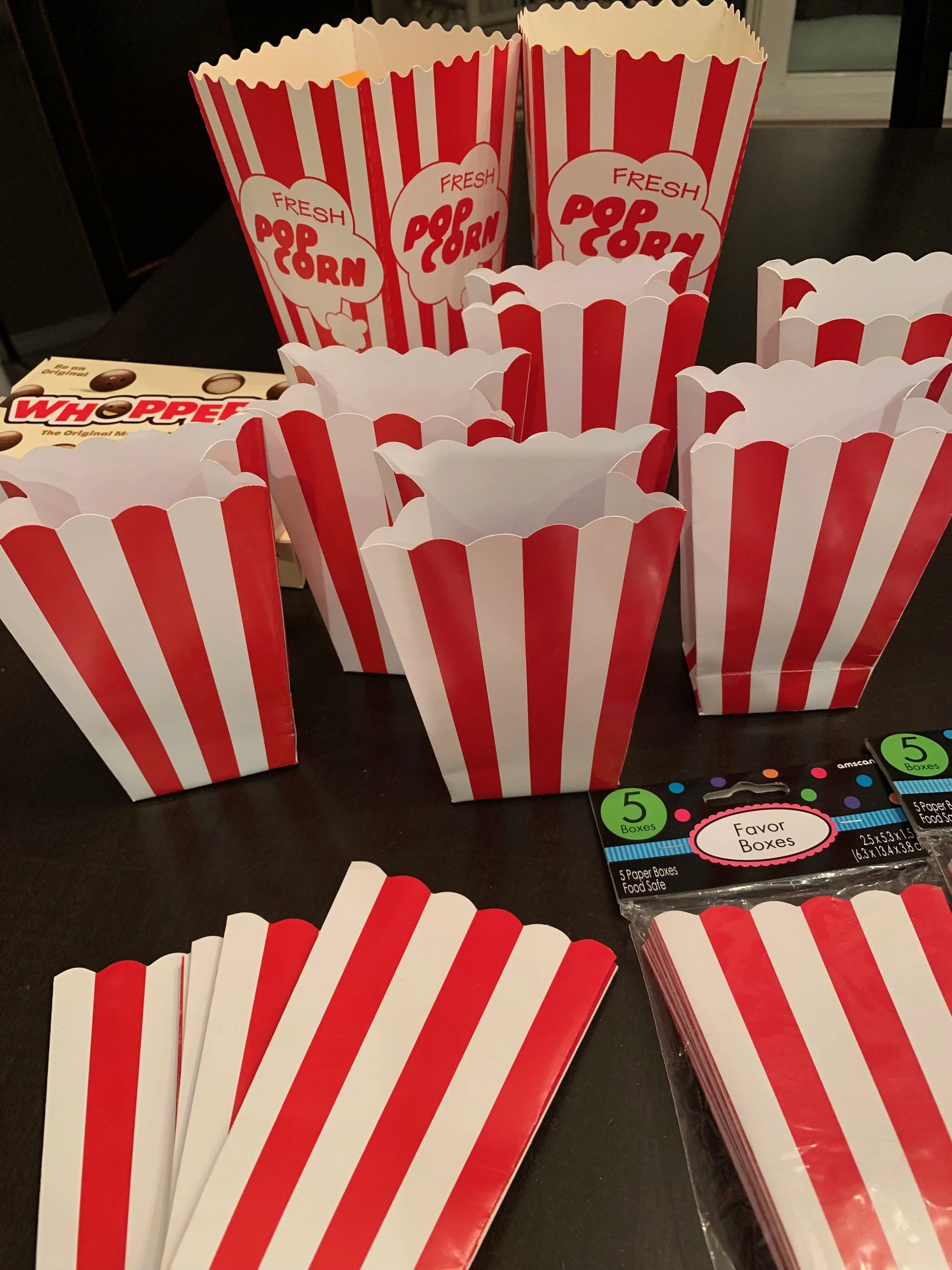 The small popcorn containers will be given to teachers but the two larger ones with print are reserved.