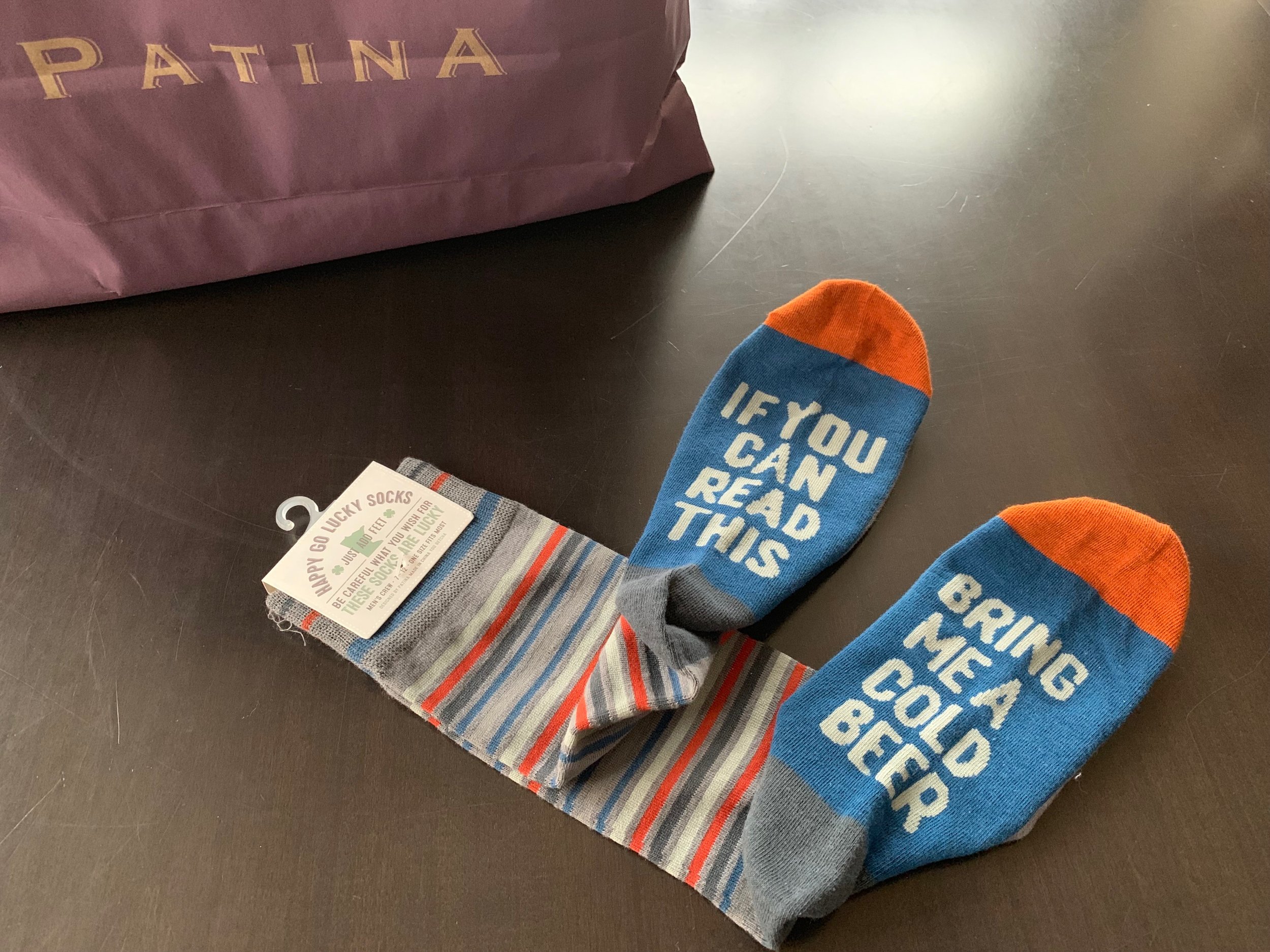 Who doesn’t need socks? And why not wear socks that can potentially keep you sitting on the couch longer since your needs will be met by anyone who can read? Patina : $12.95.
