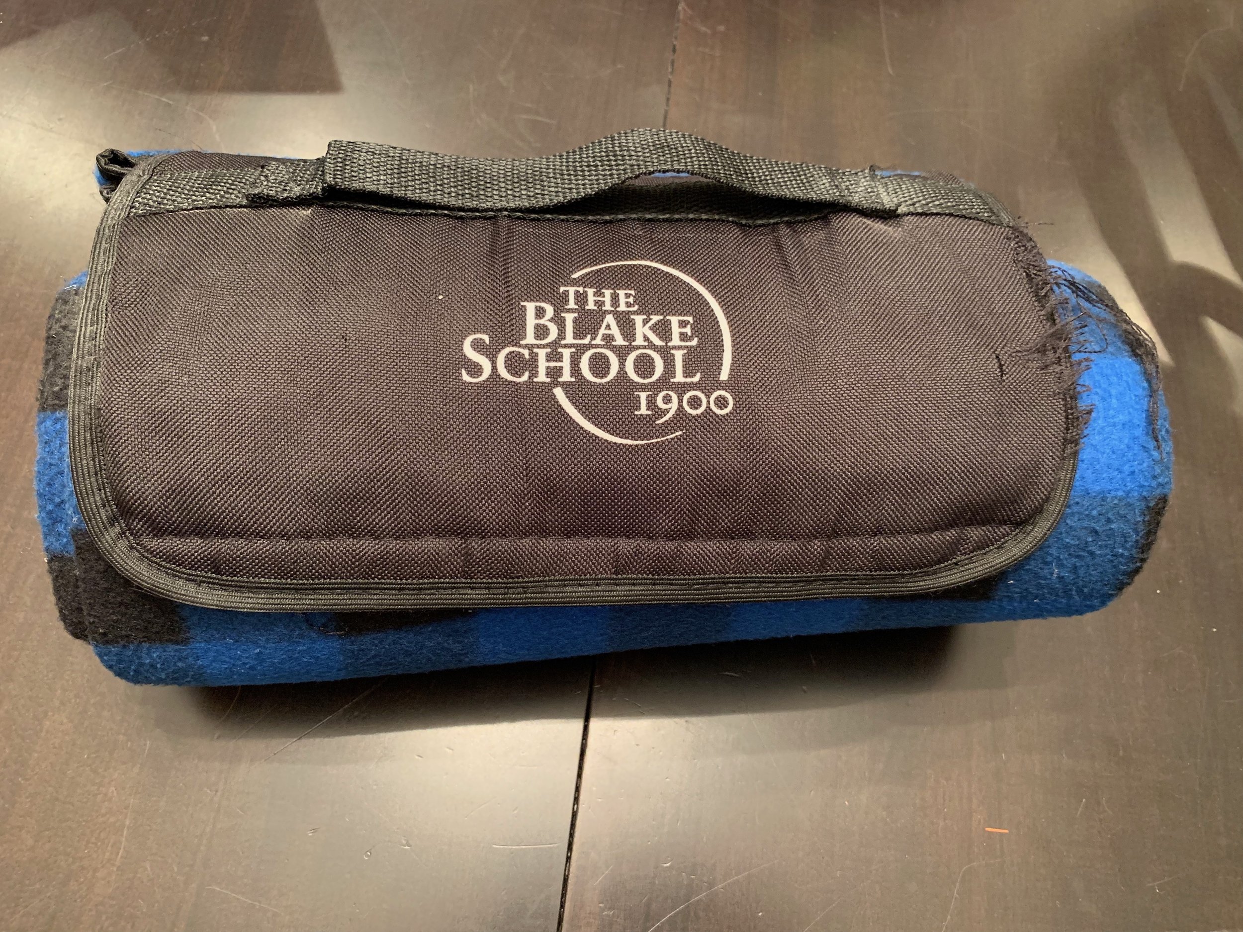 1. A blanket with waterproof backing. You can see, we have used this blanket a lot. Our kids’ school gave this to us as a welcoming gift. Folded up, the blanket only measures 12 inches x 8 inches. It doesn’t take up a lot of space, weighs only ounces and is very handy.