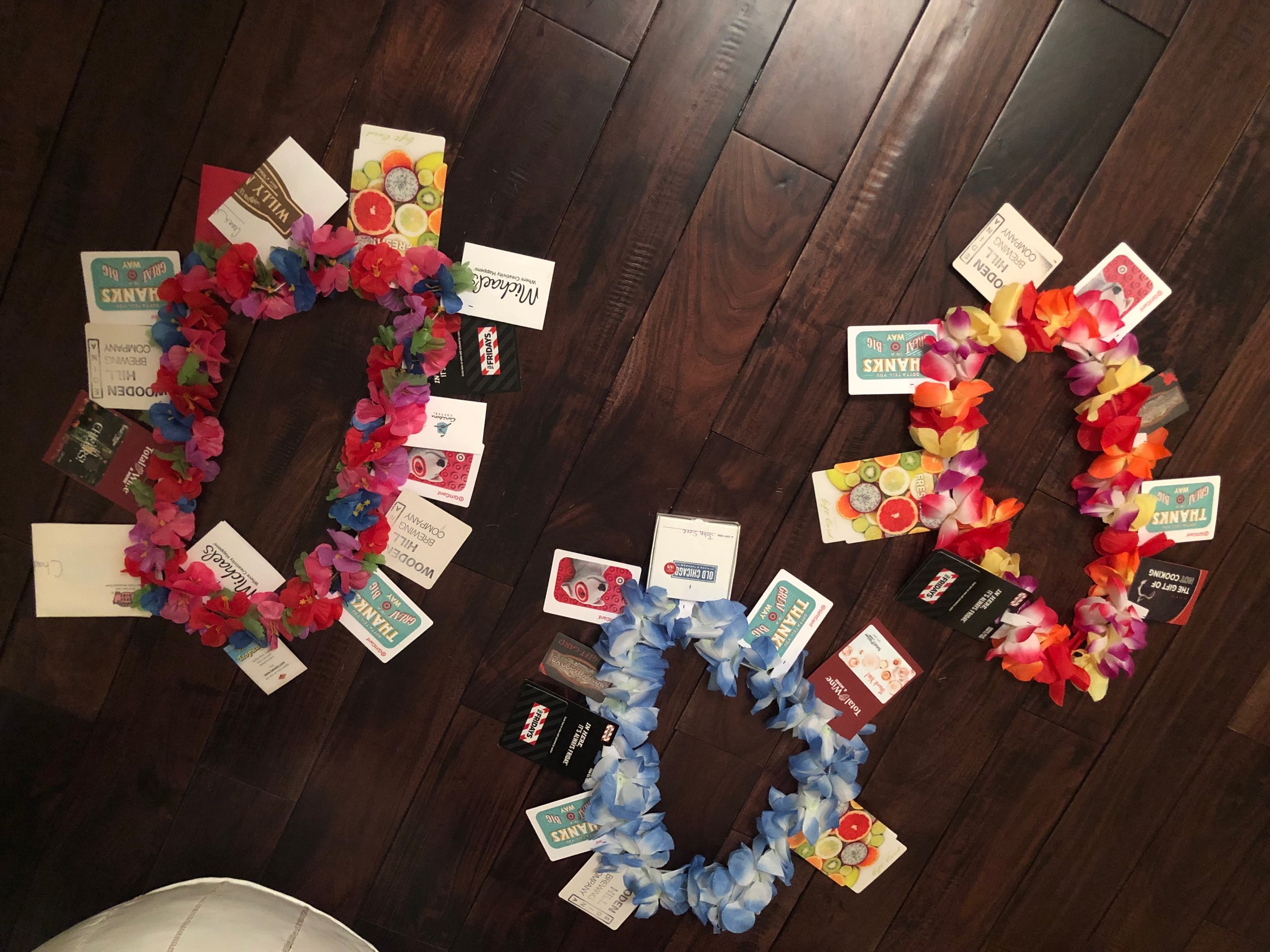 To incorporate the lei theme, I mentioned on the cards that the coaches needed a vacation after the season we just had. Popular cards were to liquor stores and to bar venues. But everyone needs a few Target cards too. One coach’s wife is crafty and she made all of our hotel door signs for away tournaments. A gift card to Michael’s was added to her husband’s lei.