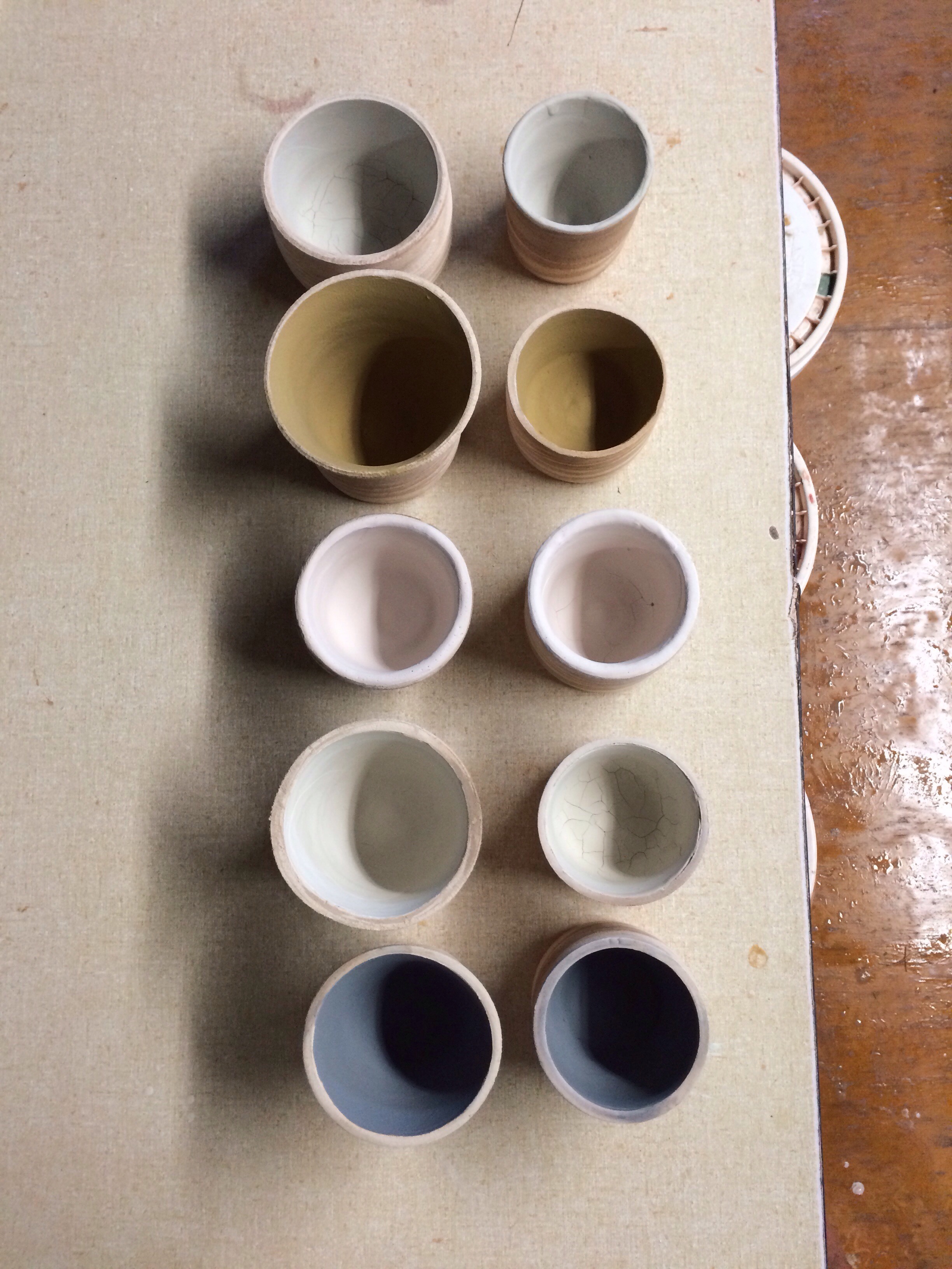 Marbled ceramic candle holders ready for the glaze kiln.