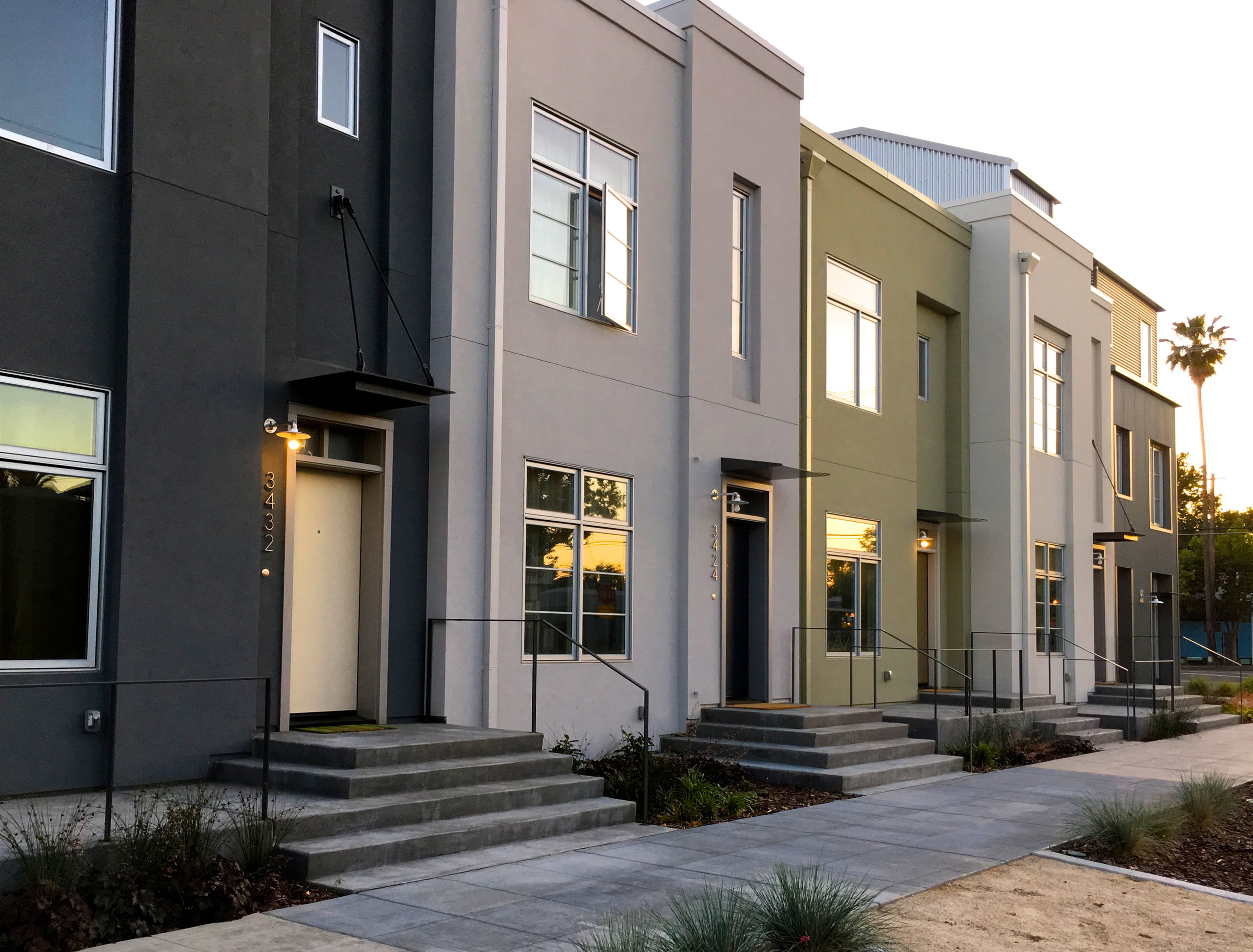   The 2nd Avenue Rowhouses  are contemporary small urban infill homes inspired by traditional brownstones.  The highly efficient units are in a walkable neighborhood, with garages banked together adjacent and separate from the houses to allow for fro