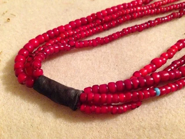 African Trade bead repair with leather - White hearts