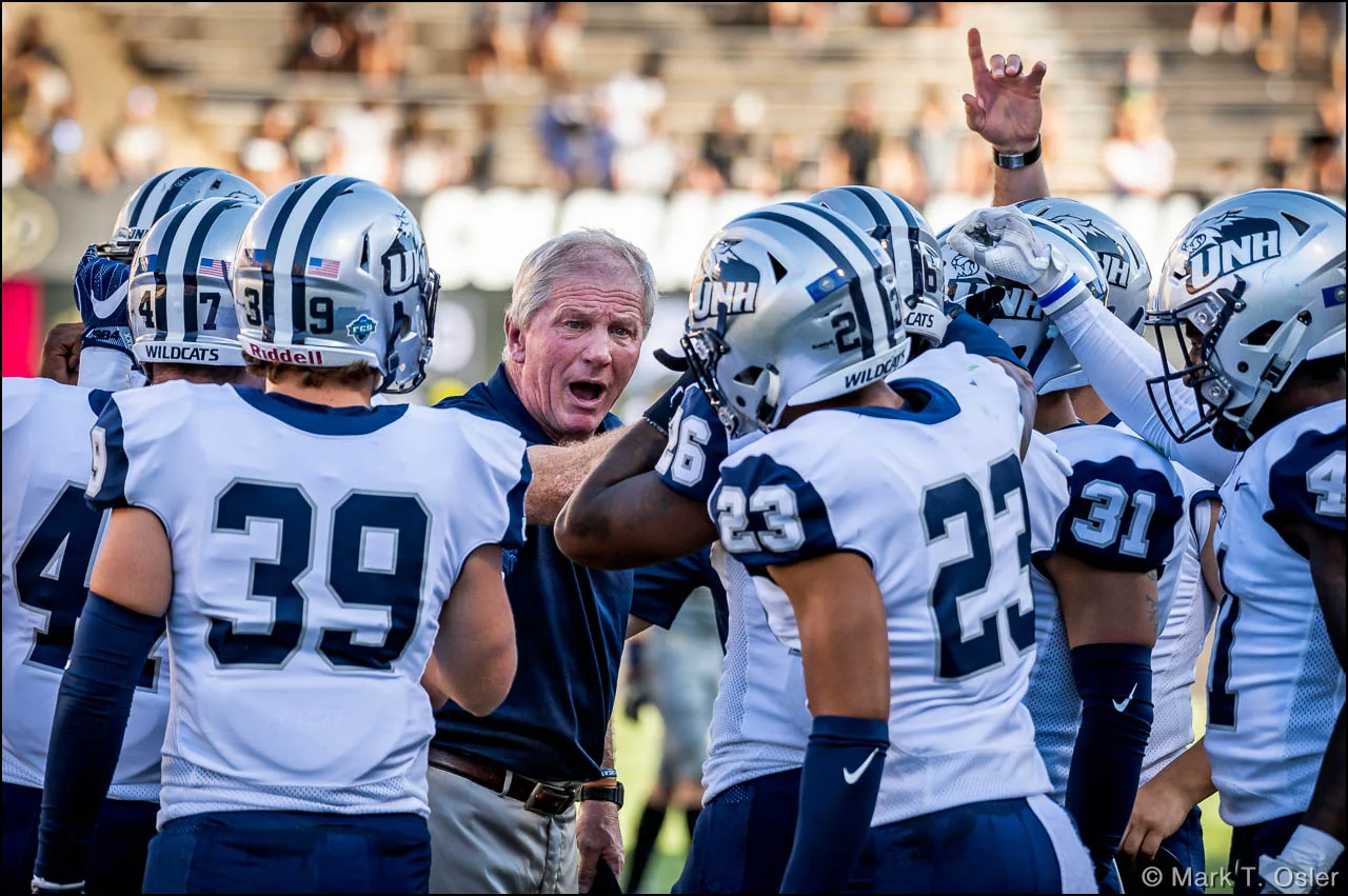 UNH football head coach Sean McDonnell tries to invigorate his team at the beginning of the third quarter. The Wildcats began the second half behind CU 28-0.