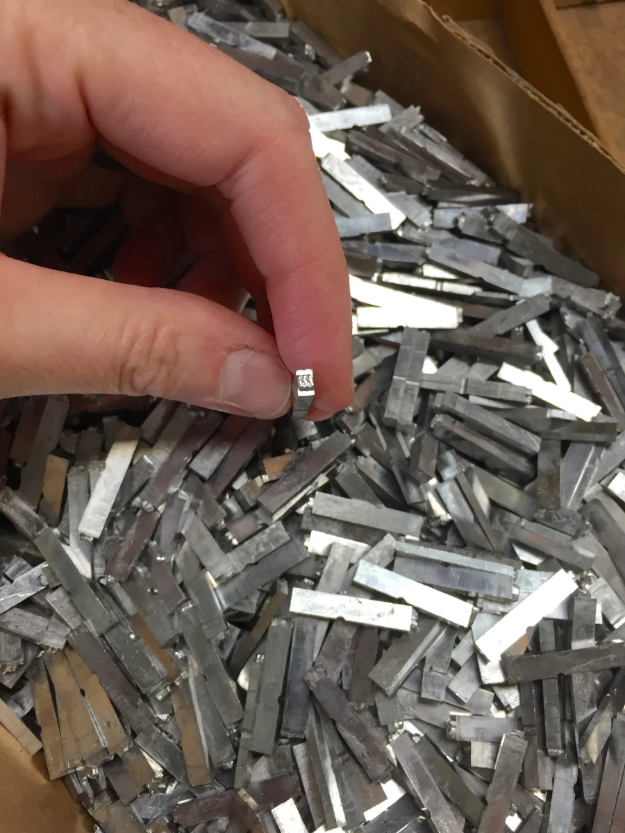 A 12pt letter "m" from the pile of pied type. It is, unfortunately, damaged and bound for the hell box.