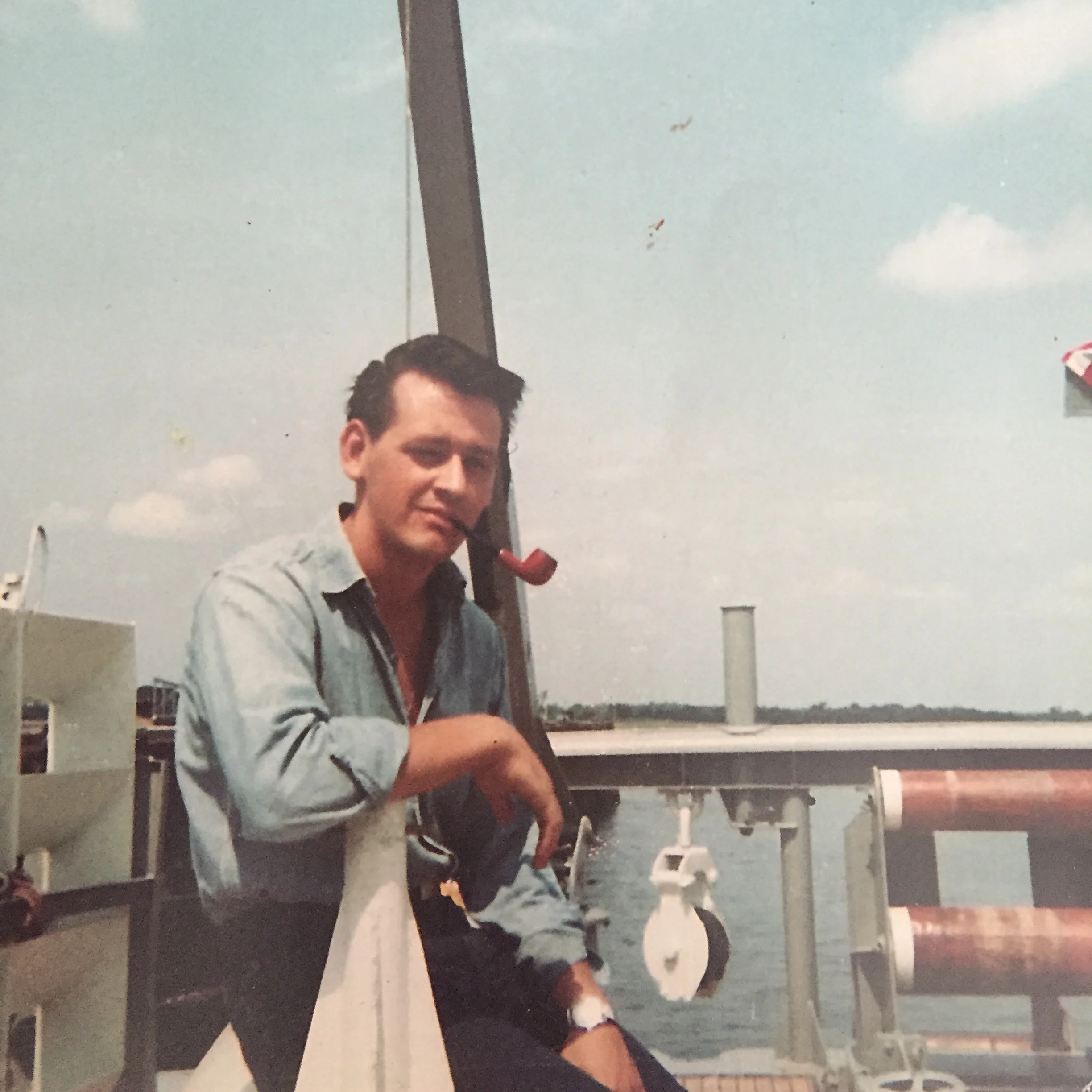 This guy...yeah that's my Dad aboard the mine sweeper on which he served during his four years in the Navy.