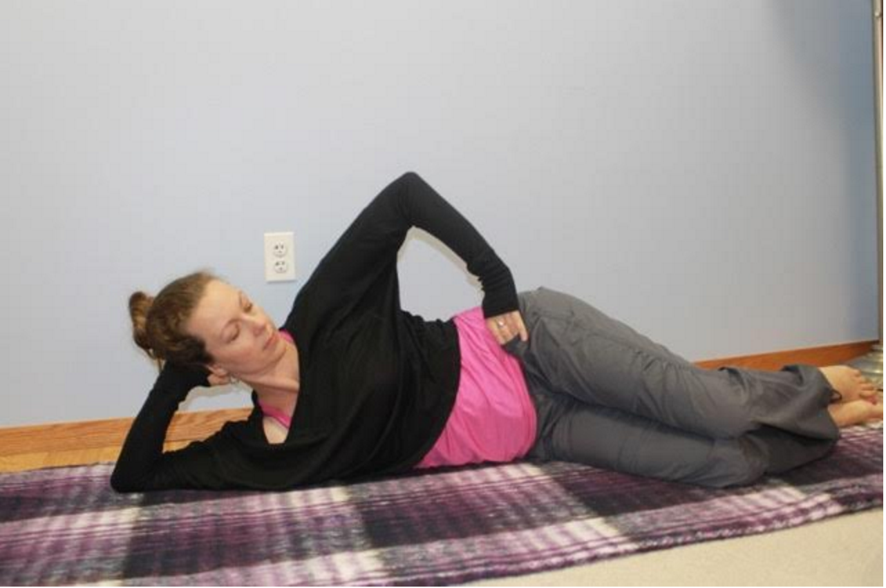 Lay on your right side with your knees bent. Engage your lower abdomen. Keep your trunk and pelvis still as you lift your left knee up towards the ceiling. Repeat 30 times and switch sides. For more load, loop a resistance band around the thighs.
