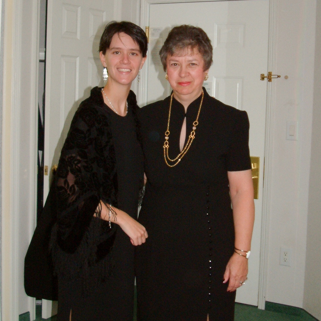 This is one of about five pictures I could find of me with my Mom...yes I'm wearing a dress and fishing lure earrings. 