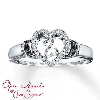 Open Hearts Ring 1/15 ct tw Diamonds Sterling Silver The Open Hearts by Jane Seymour® design framed by a heart of brilliant white diamonds is at the center of this captivating ring for her. Black diamonds decorate the sterling silver band of this fine jewelry ring. Black Diamonds are treated to permanently create the intense black color. Diamond Total Carat Weight may range from .065 - .08 carats.