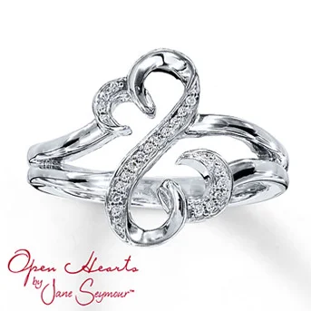 Open Hearts Ring 1/20 ct tw Diamonds Sterling Silver From the Open Hearts by Jane Seymour® collection. The iconic Open Hearts design is decorated with brilliant round diamonds set in sterling silver in this irresistible diamond ring for her. Total diamond weight is 1/20 carat. Diamond Total Carat Weight may range from .04 - .06 carats.
