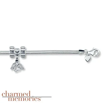 Charmed Memories® Open Hearts by Jane Seymour® 8" Bracelet Sterling Silver bracelet features an Open Hearts by Jane Seymour® angel charm accented with genuine Swarovski® crystals. Comes with two stopper charms.